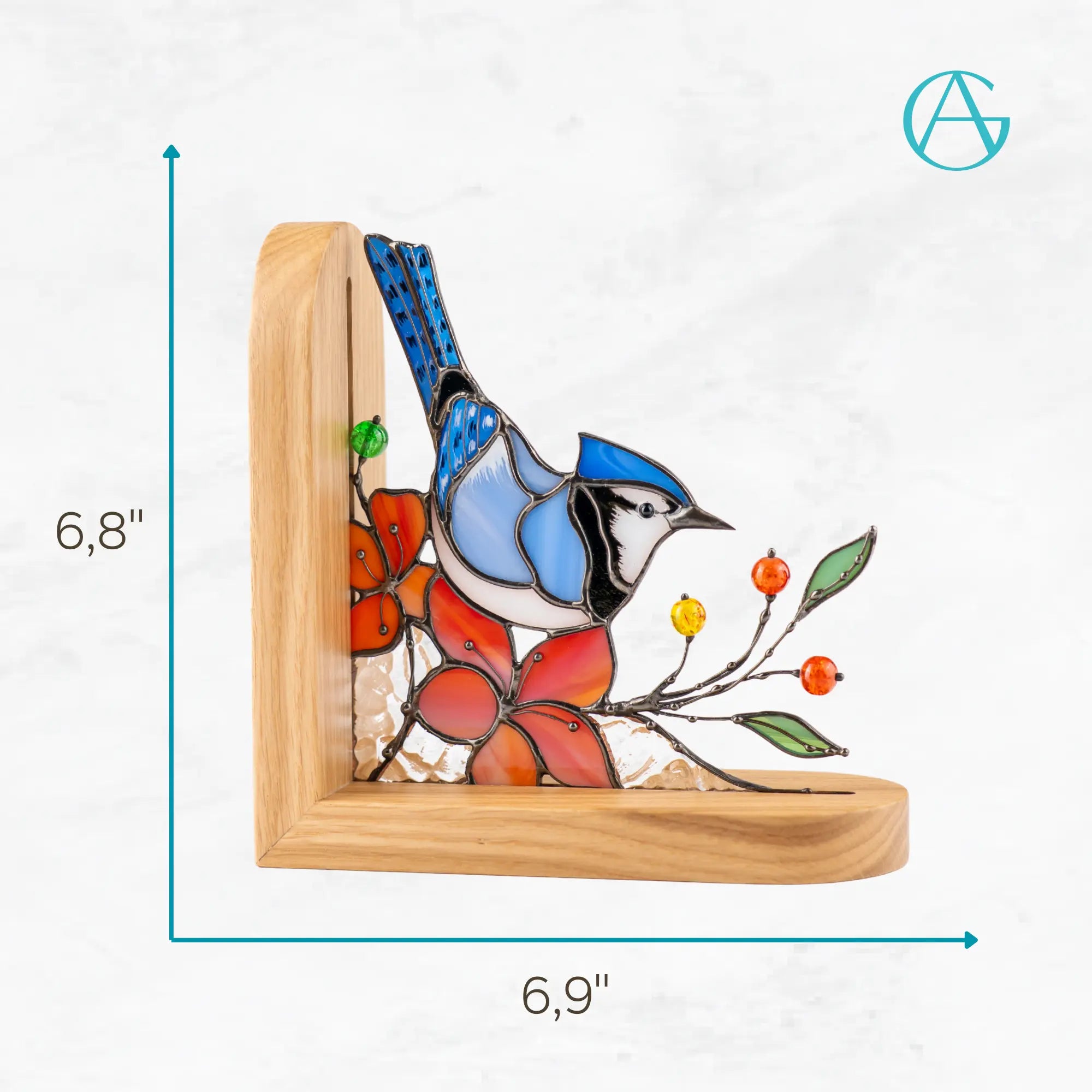 Stained glass bookend with design of a blue jay and red flowers, with measurements indicated 6,8 x 6,9 inches