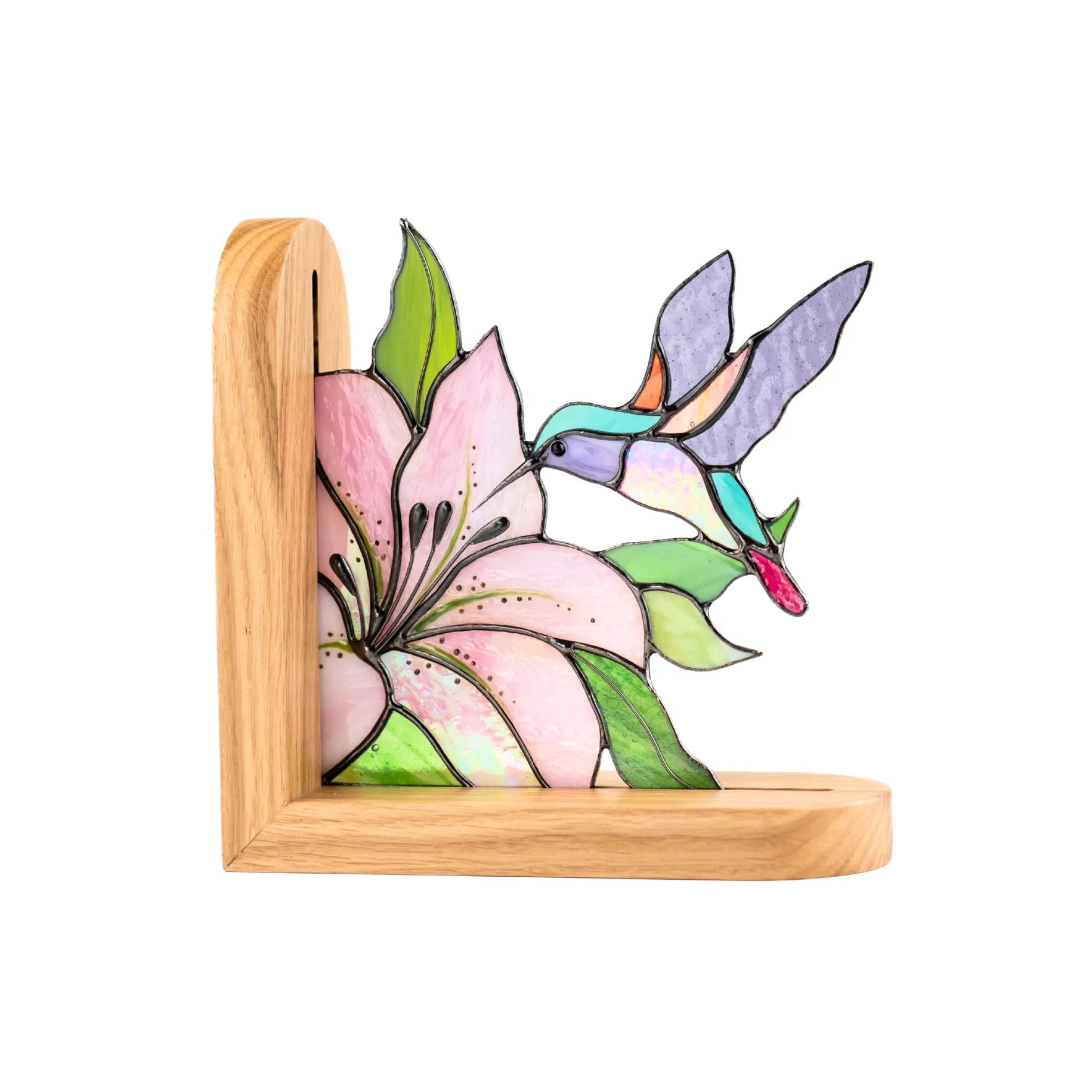 Stained glass bookend hummingbird and  pink flower on a wooden base.