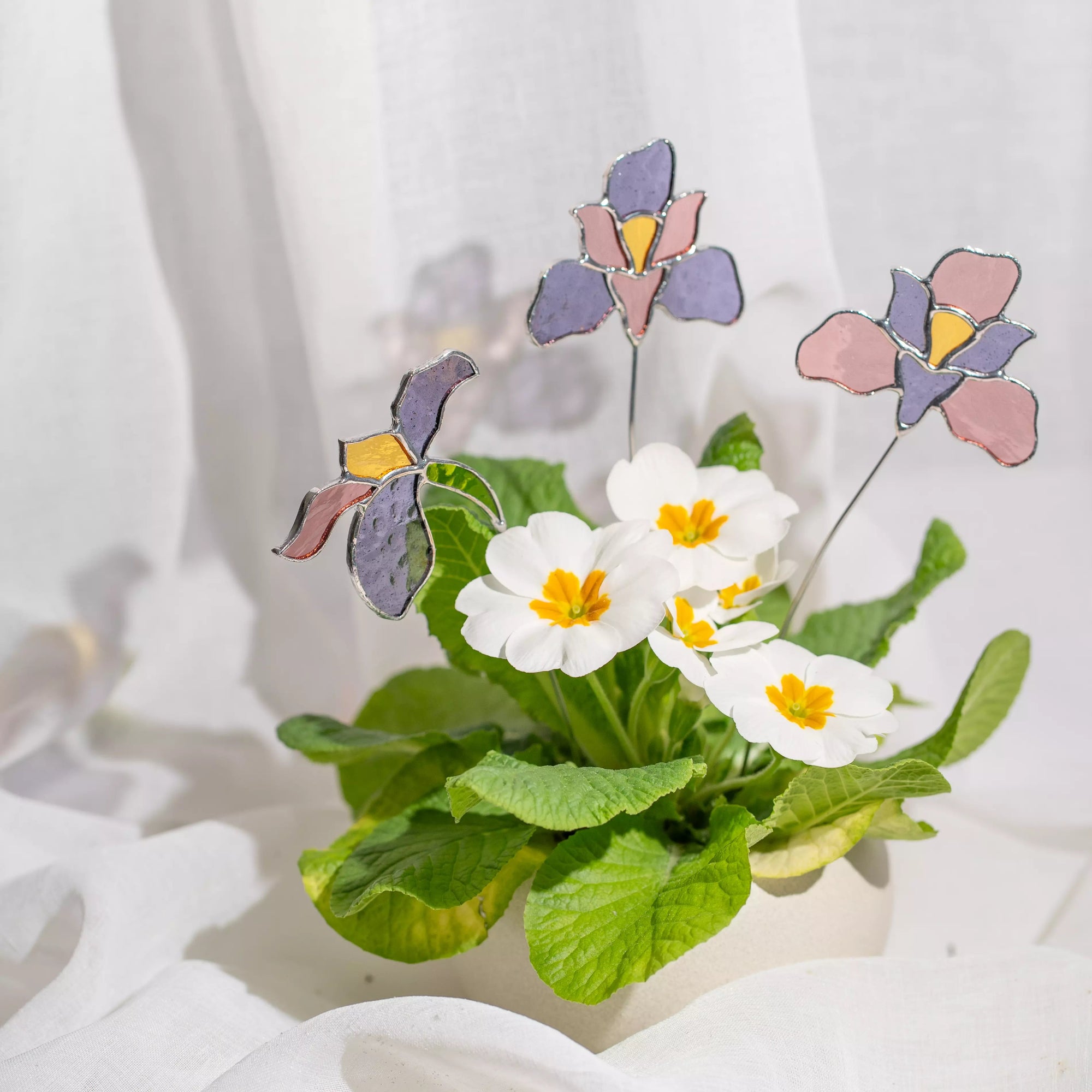 Stained glass plant stakes flowers on a white background