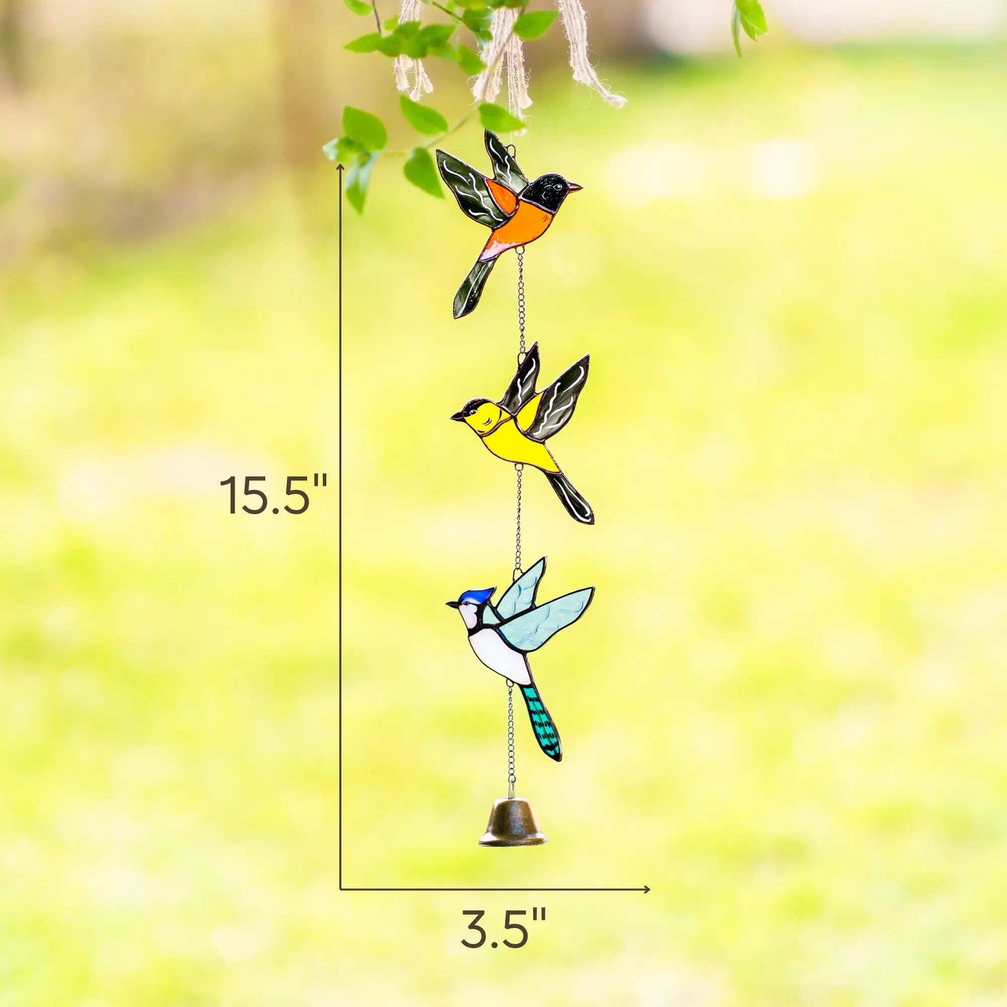 Stained glass hanging birds with measurements 15.5 x 3.5 inches against a blurred natural background