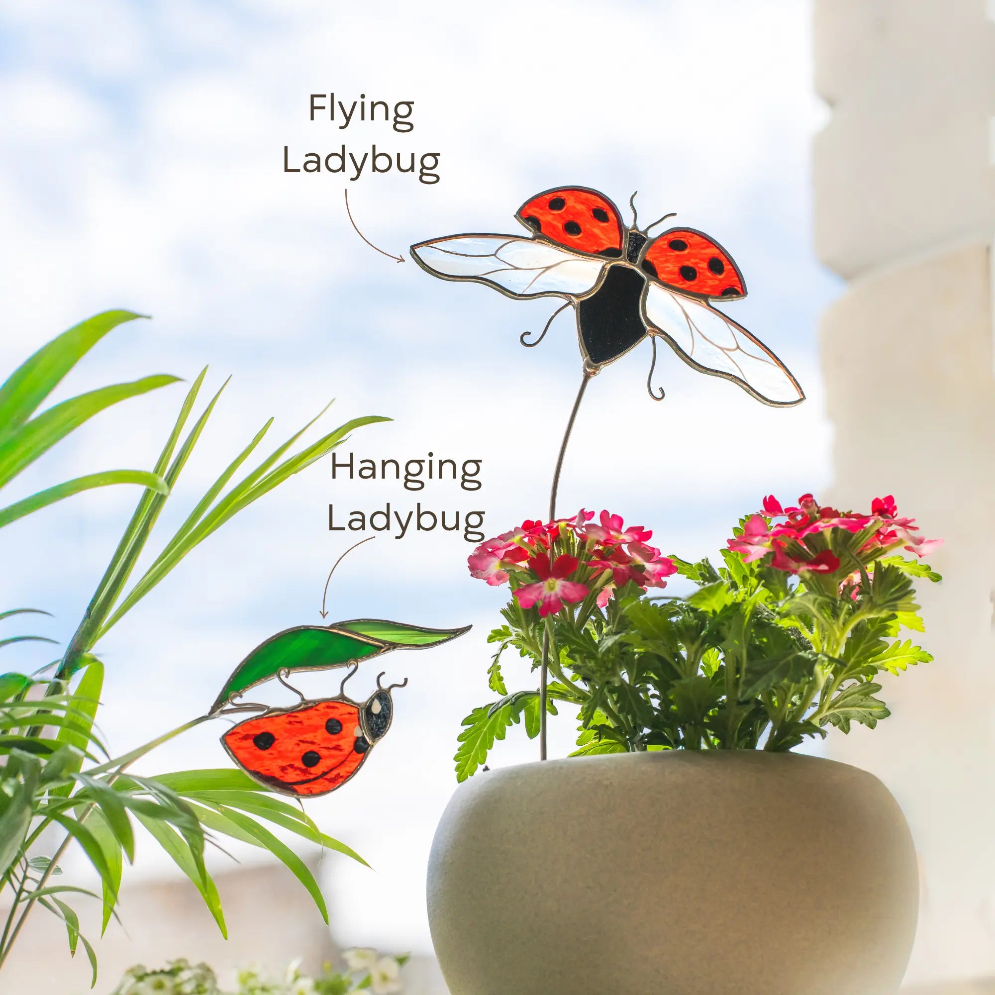 Decorative stained glass ladybug plant stakes: flying one and hanging one