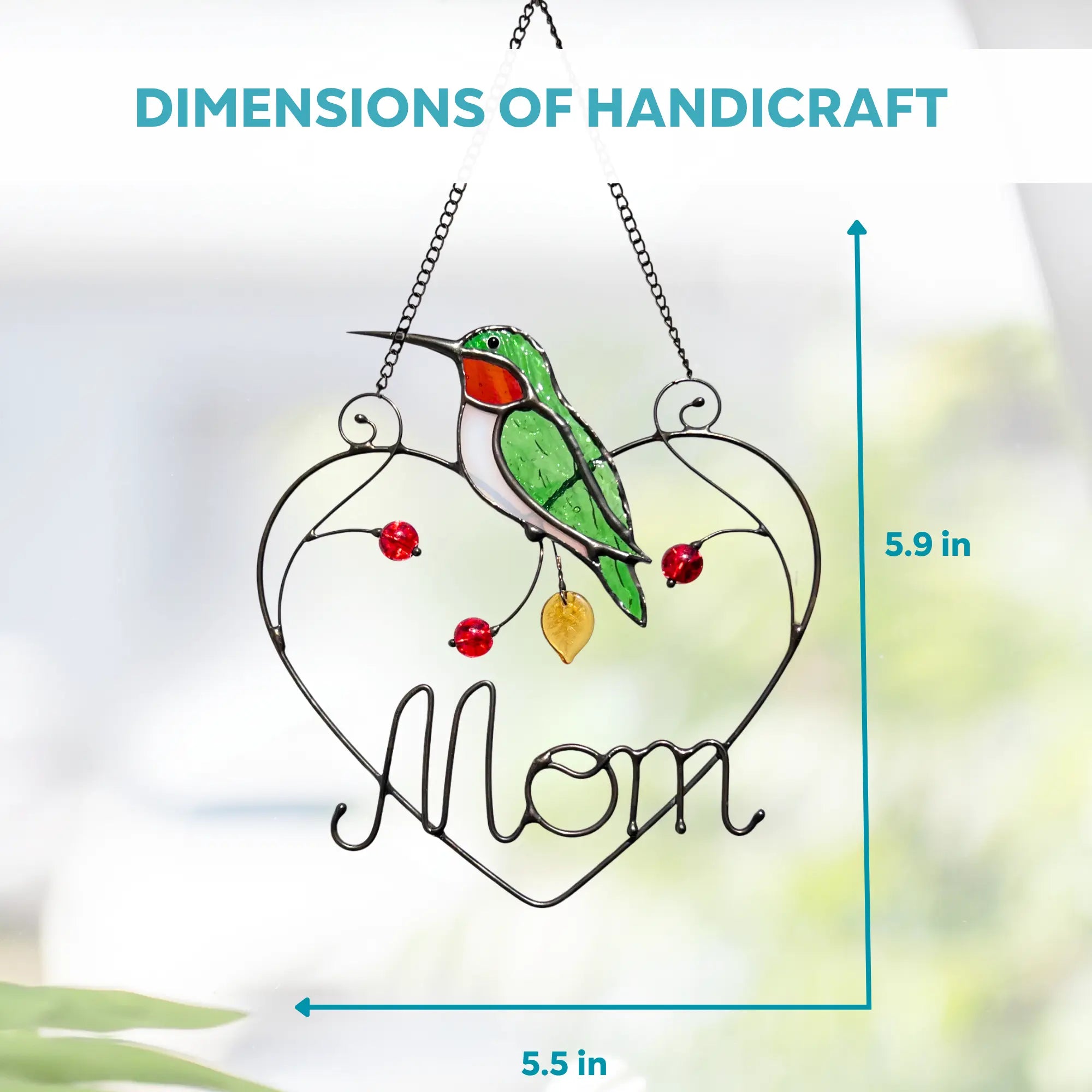 Stained glass piece with a hummingbird and 'Mom' on a heart, with dimensions displayed: 5.5 x 5.9 inches