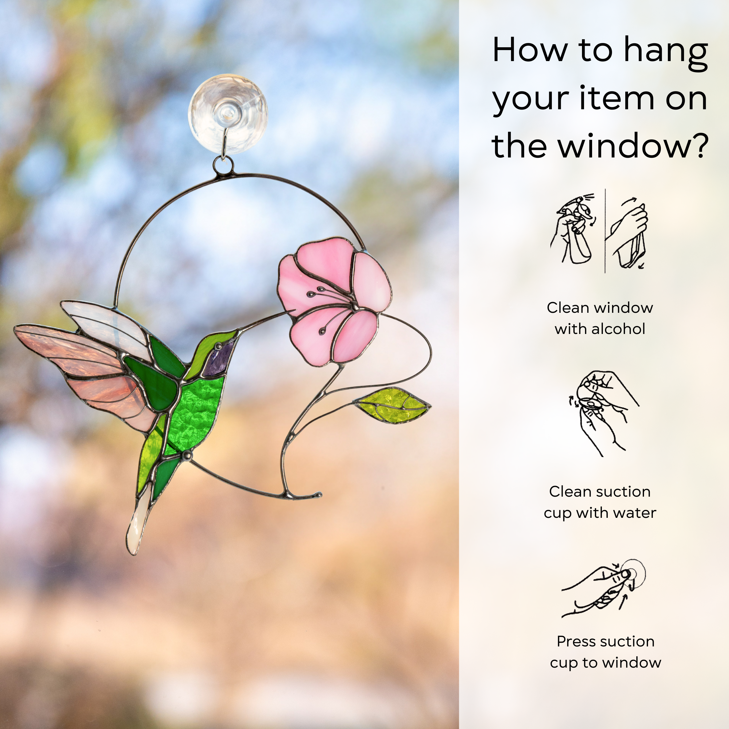 Emerald hummingbird with pink flower suncatcher attached on a window with instructions beside: clean window and suction cup, press a cup to the surface.