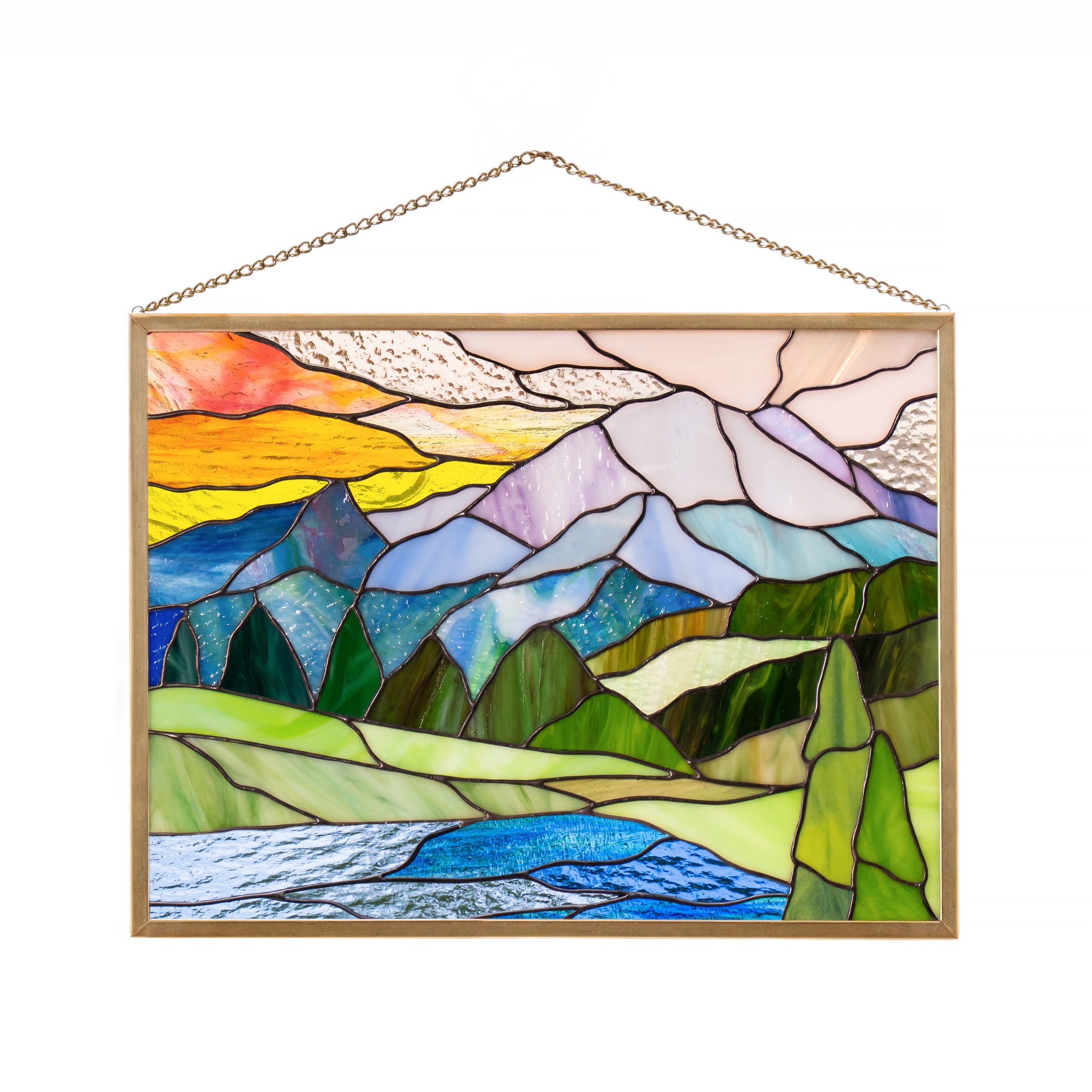 Handmade stained glass panel featuring a glacier mountain landscape with flowing river and cool blue tones.