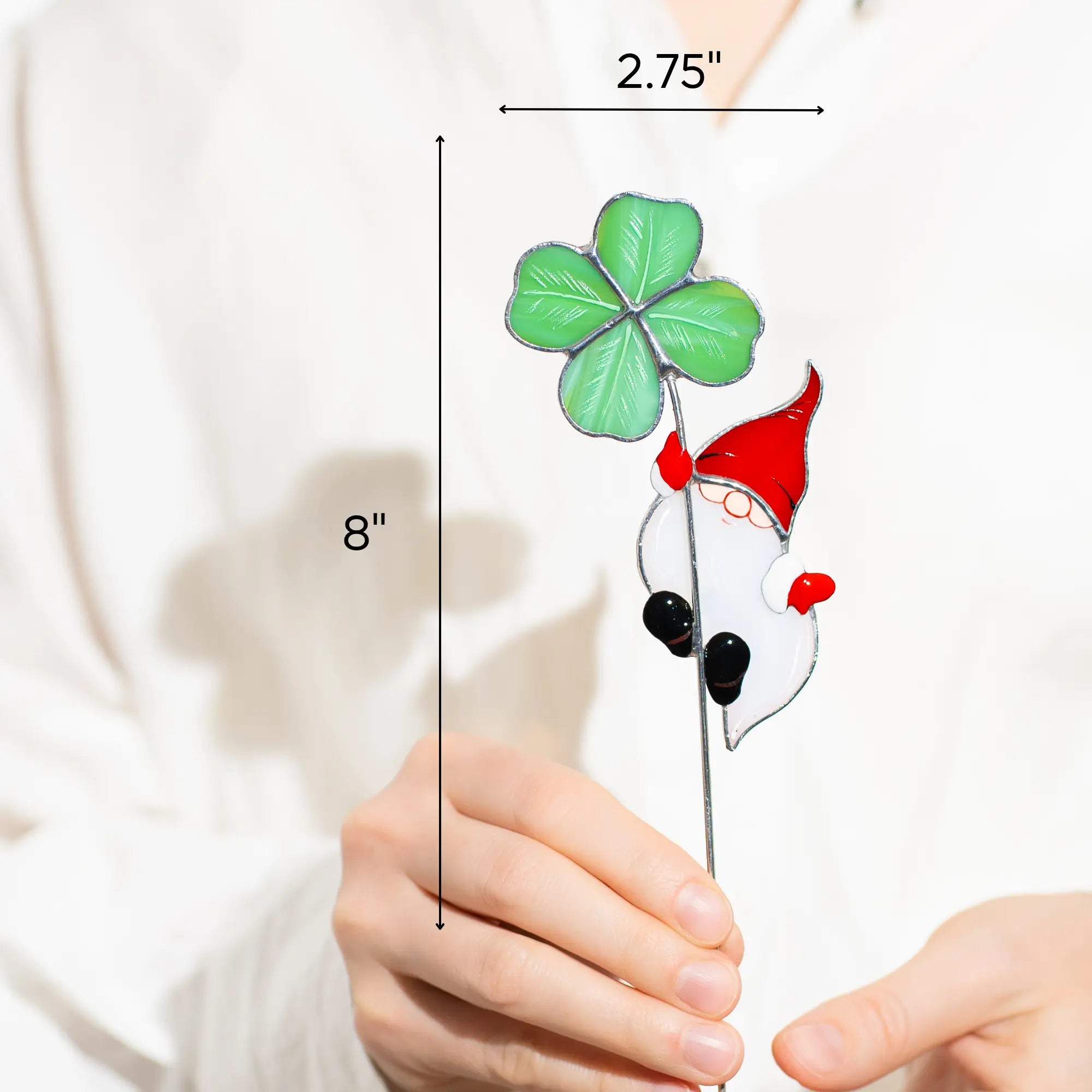 Stained glass gnome with a four-leaf clover held by hands, with measurements indicated 2.75 x 8 inches
