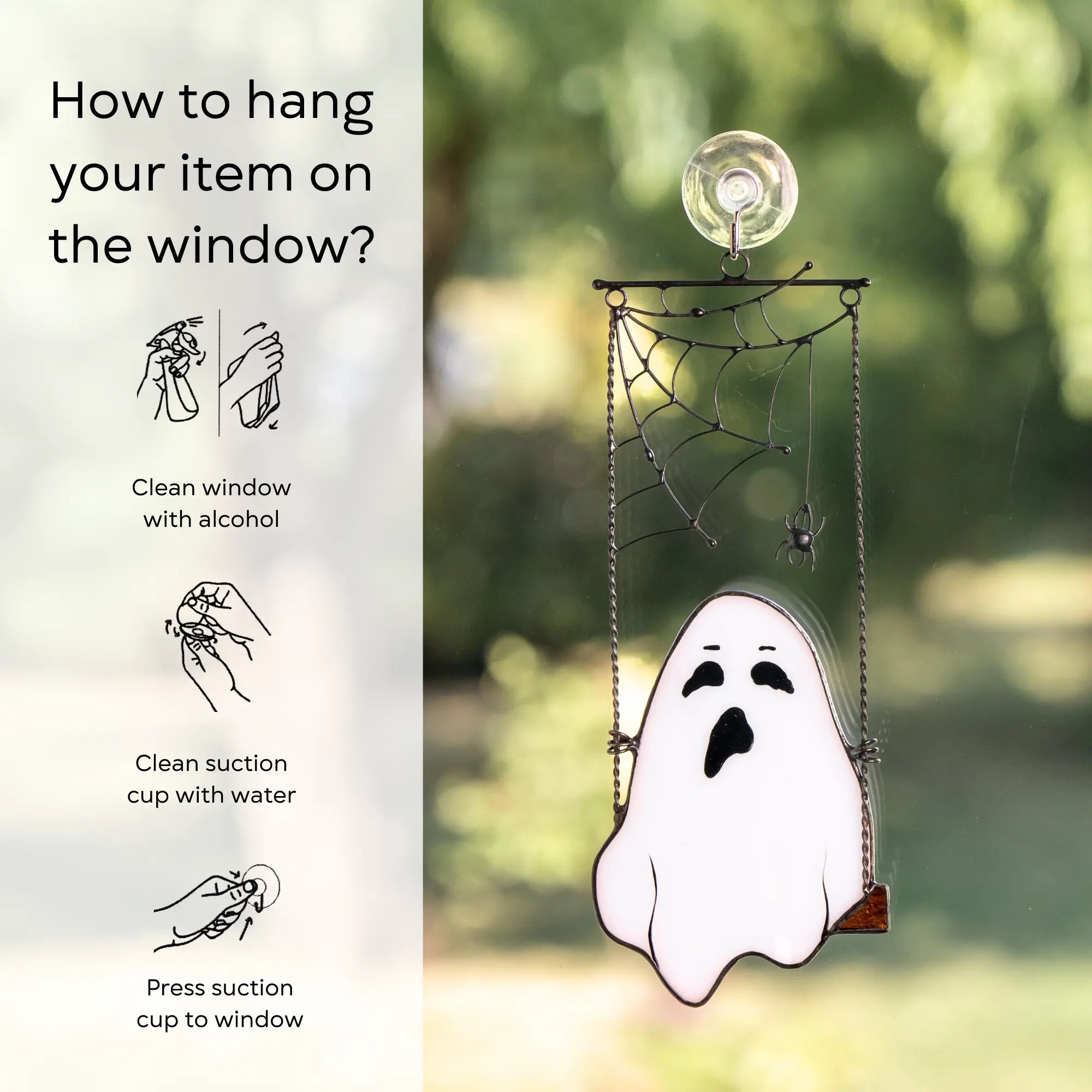Ghost-shaped window hanging with instructions on how to hang it: clean window and suction cup, press a cup to the surface.