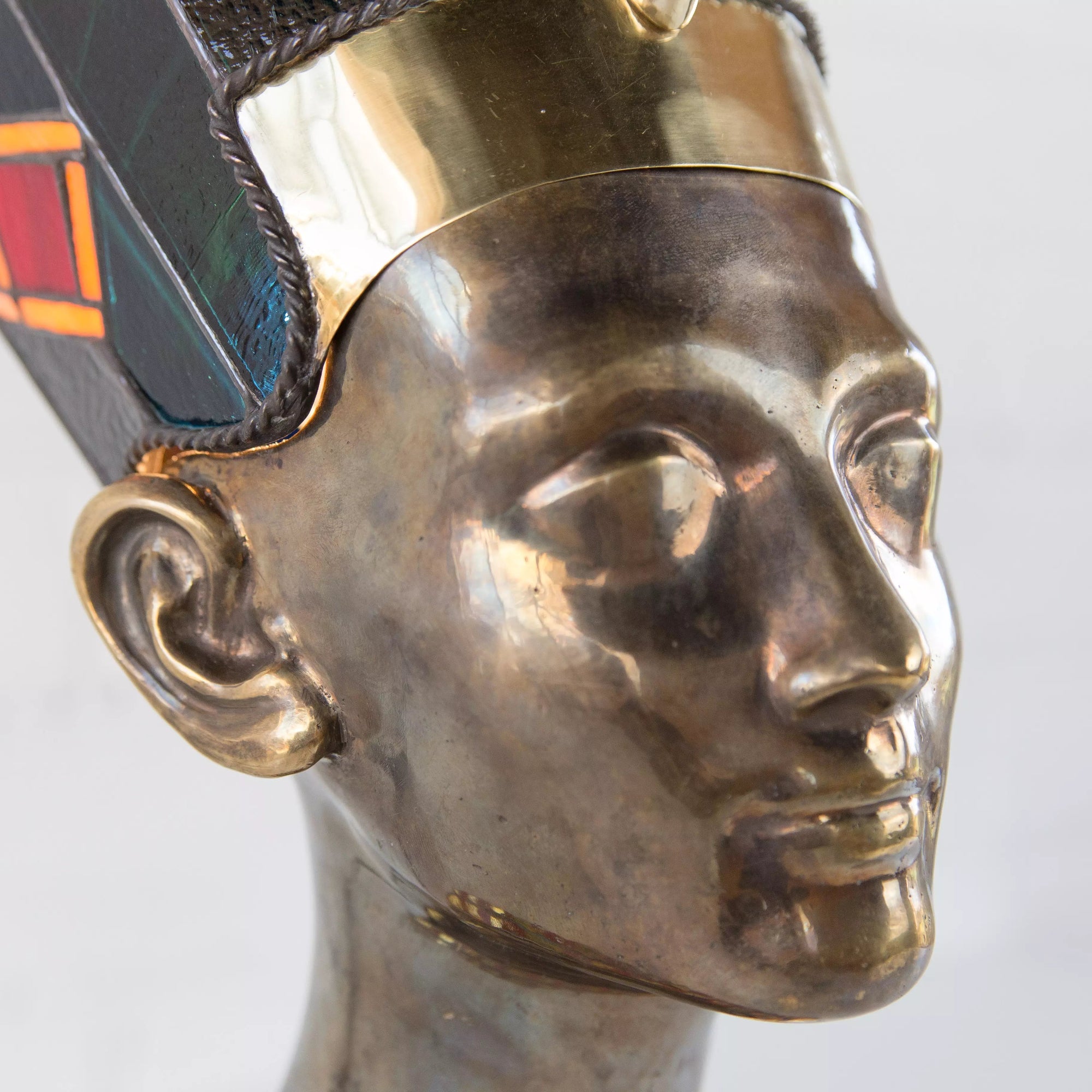Detailed view of Nefertiti stained glass with intricate lead lines and textured amber 