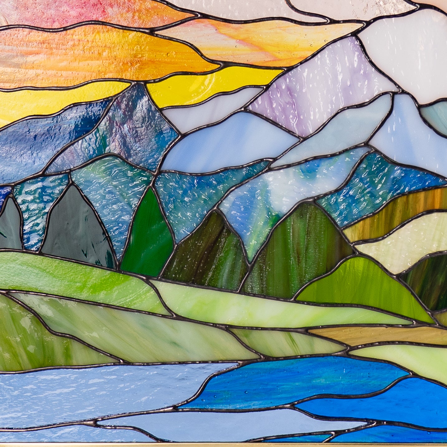Framed stained glass Glacier panel close-up view, showing detailed glasswork in icy blues and whites.
