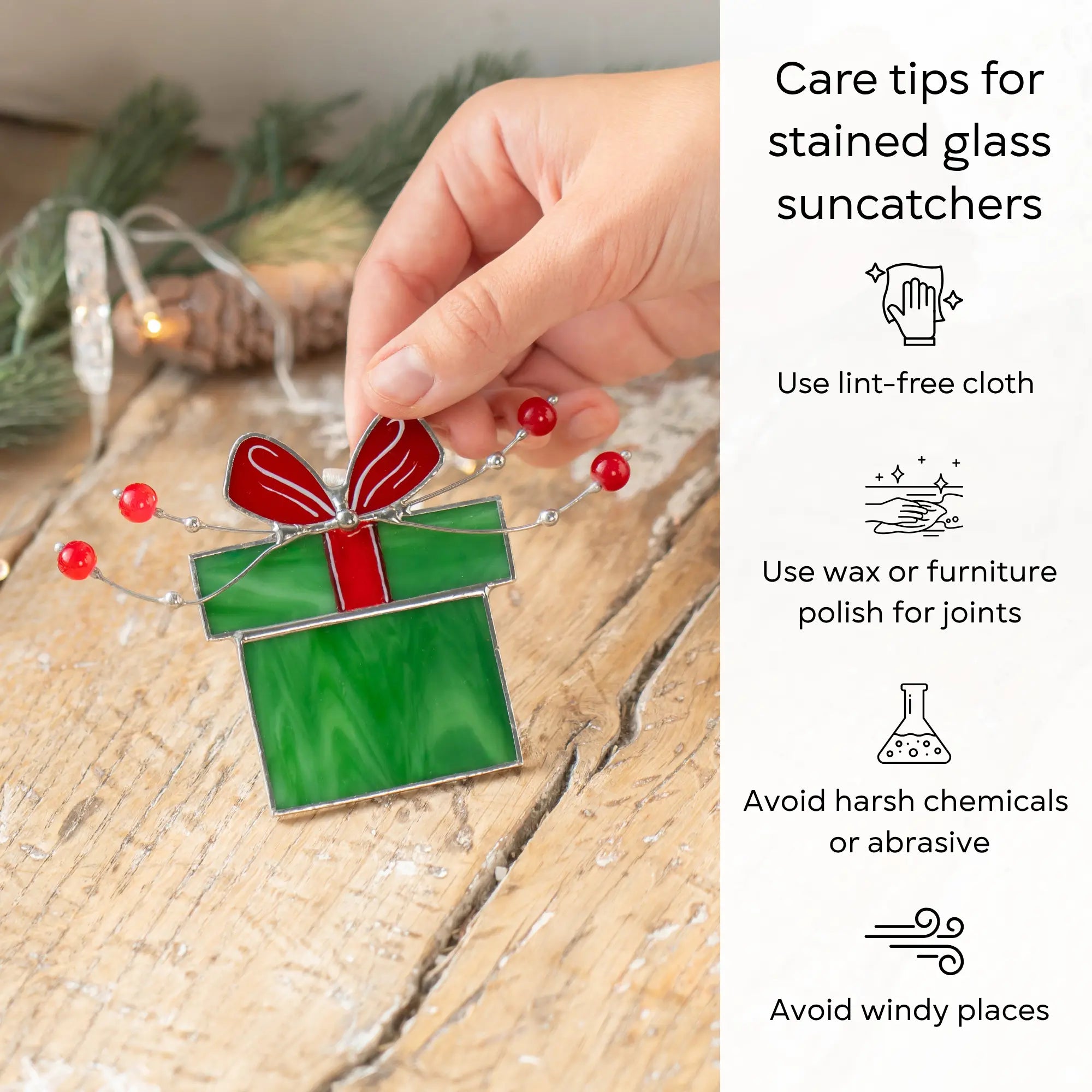Stained glass gift box with a red ribbon and silver wire, embellished with small red beads with care tips beside: use lint-free cloth, polish joints with car wax or furniture polish, avoid harsh chemicals, and windy places.