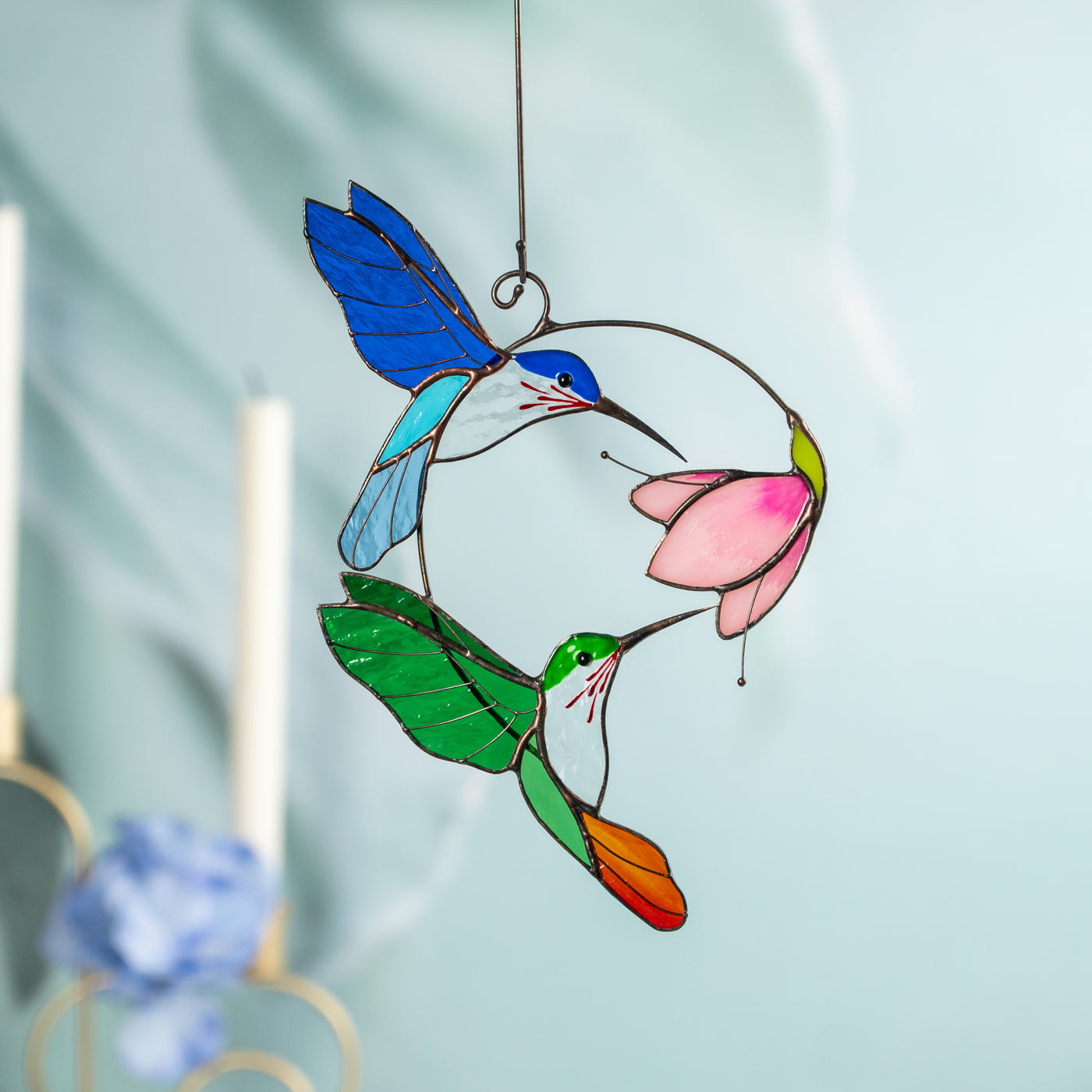 Stained glass hummingbirds in vibrant blue and green with pink flower for windows