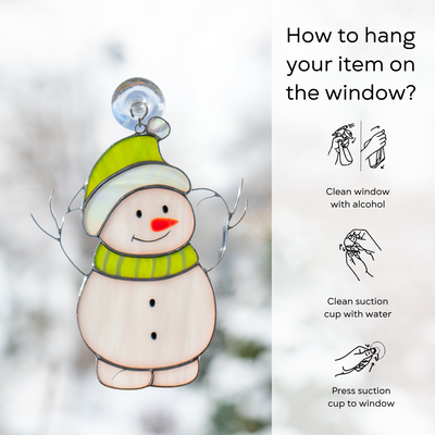 Snowman suncatcher hanging on window, infographic shows suction cup application steps: clean window and suction cup, press a cup to the surface.