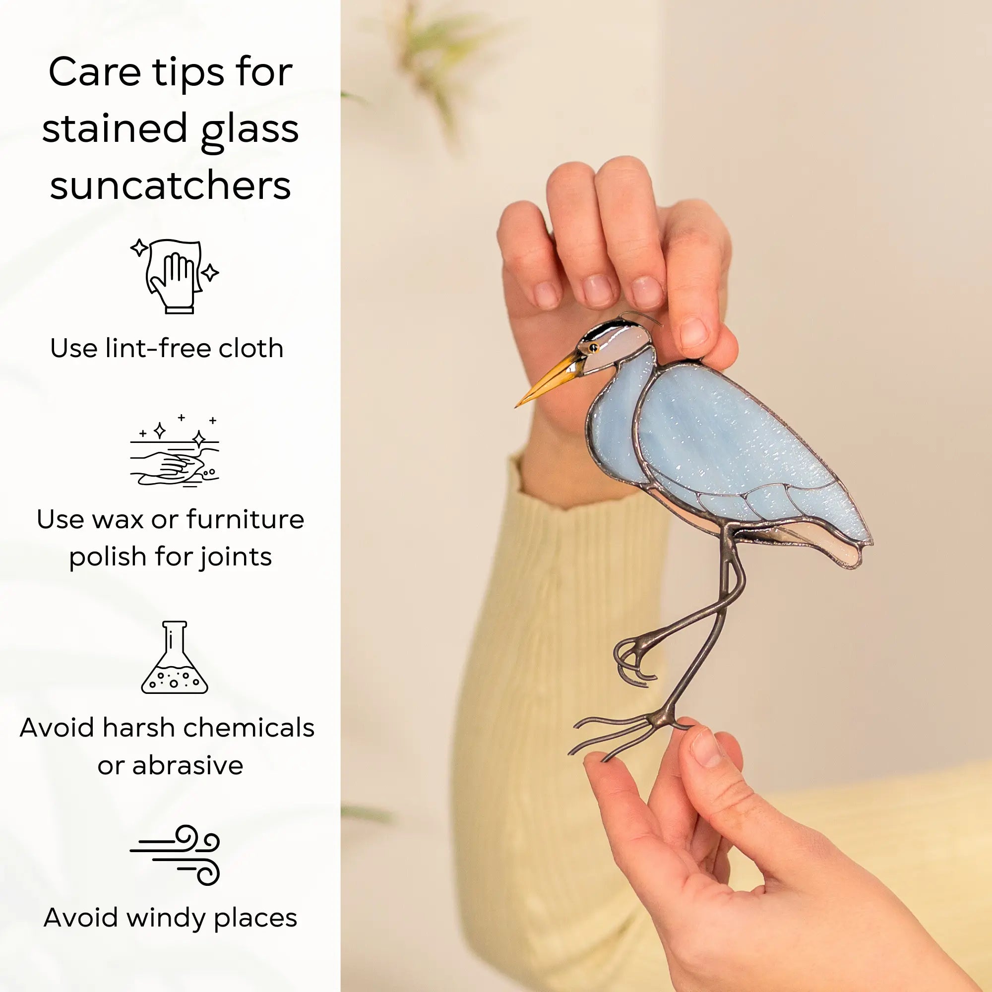 Care tips for stained glass suncatchers with a stained glass heron ornament held by hands: use lint-free cloth, polish joints with car wax or furniture polish, avoid harsh chemicals, and windy places.