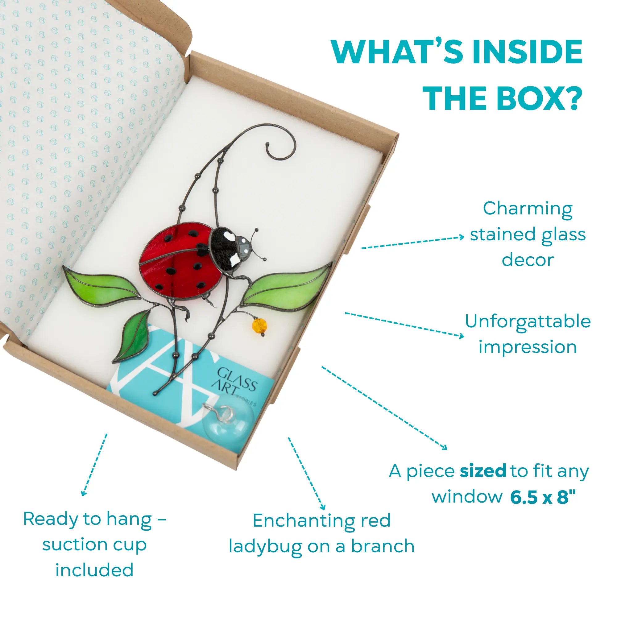Stained glass decor of a red ladybug on a branch in an open box with branded card and suction cup included