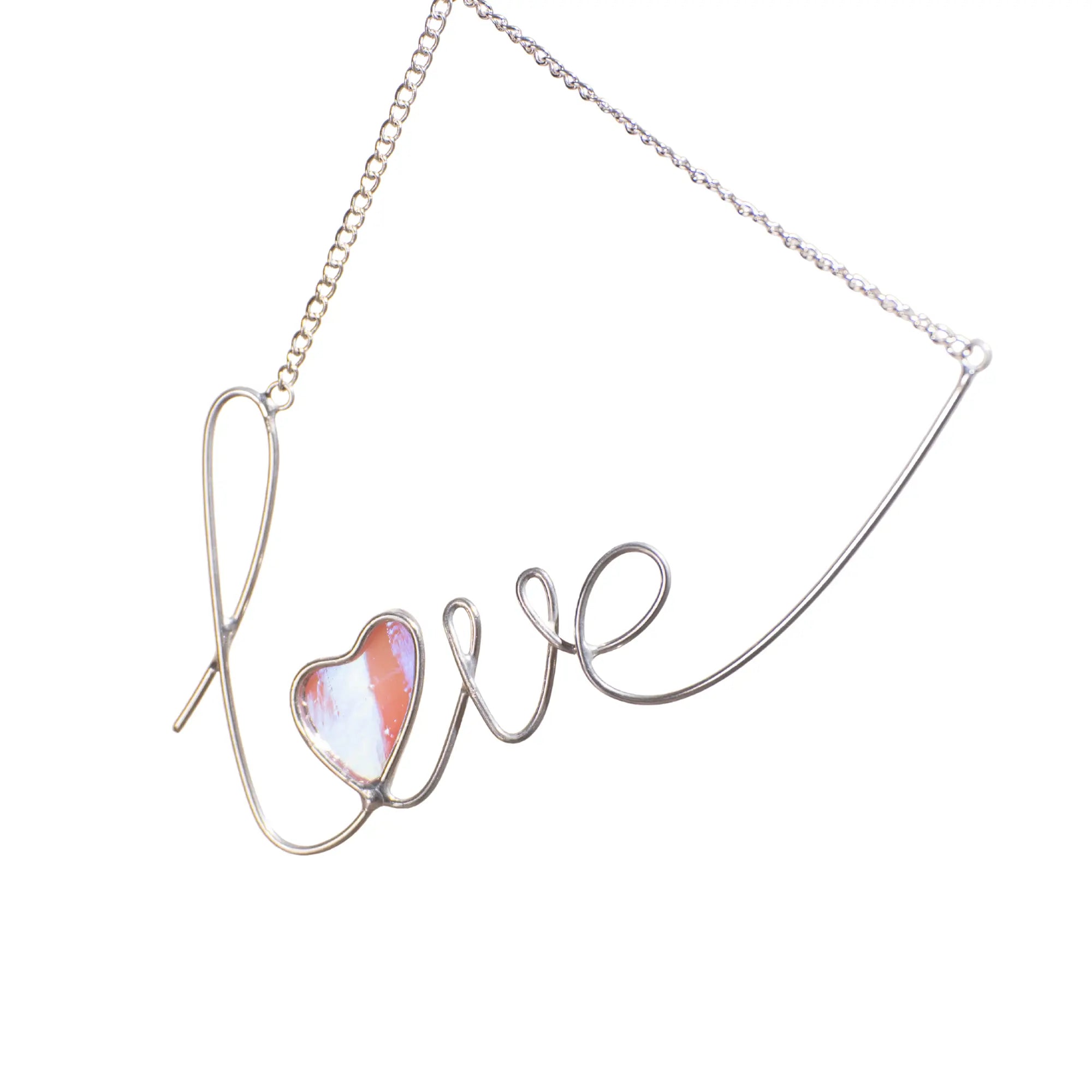 Handmade love stained glass wire sign featuring a silver wire script and an iridescent pink glass heart.