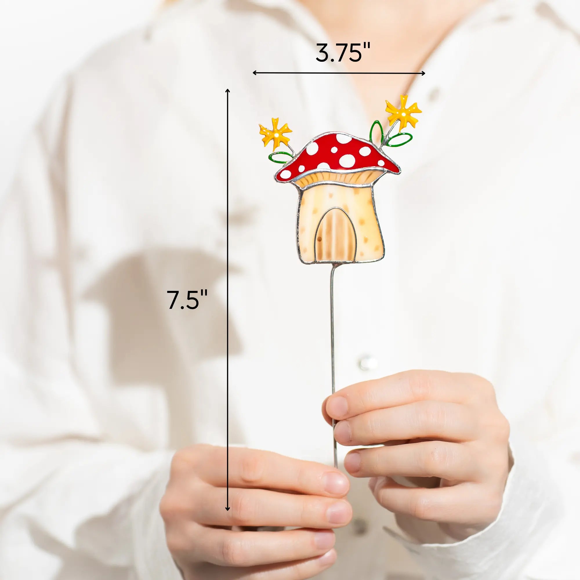 Measurement of a stained glass mushroom-shaped house is 3.75 x 7.5 inches