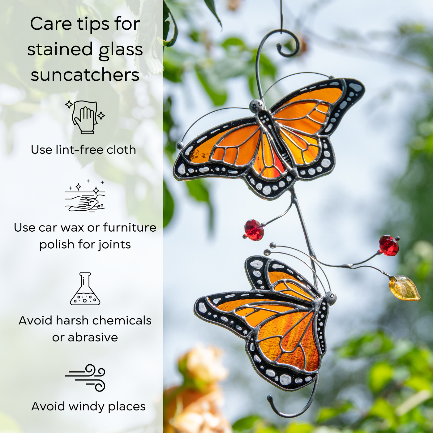 Stained glass monarch suncatcher hanging outdoors among tree branches, care tips beside: use lint-free cloth, polish joints with car wax or furniture polish, avoid harsh chemicals, and windy places.