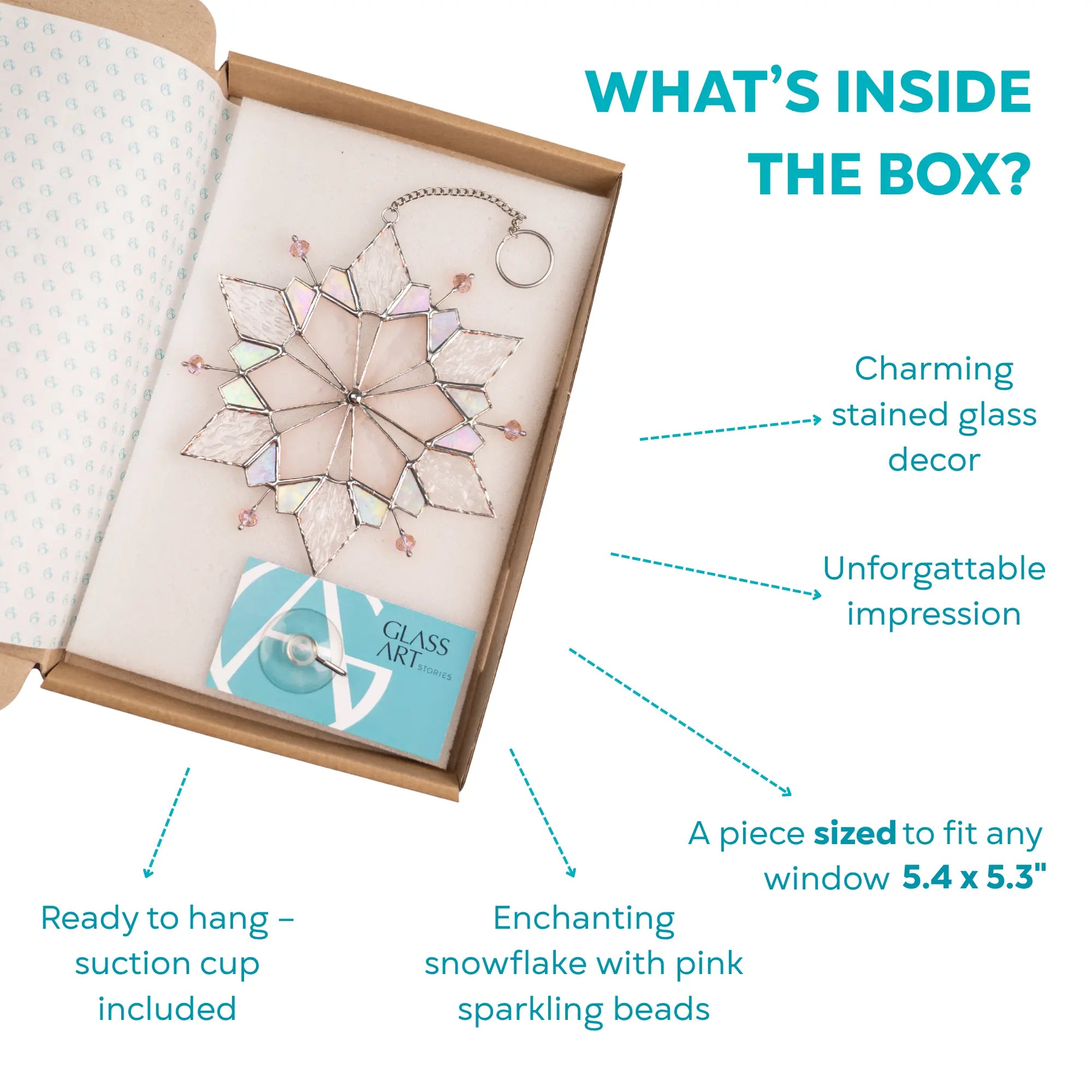 Open box containing a stained glass snowflake suncatcher sized 5.4 x 5.3 inches