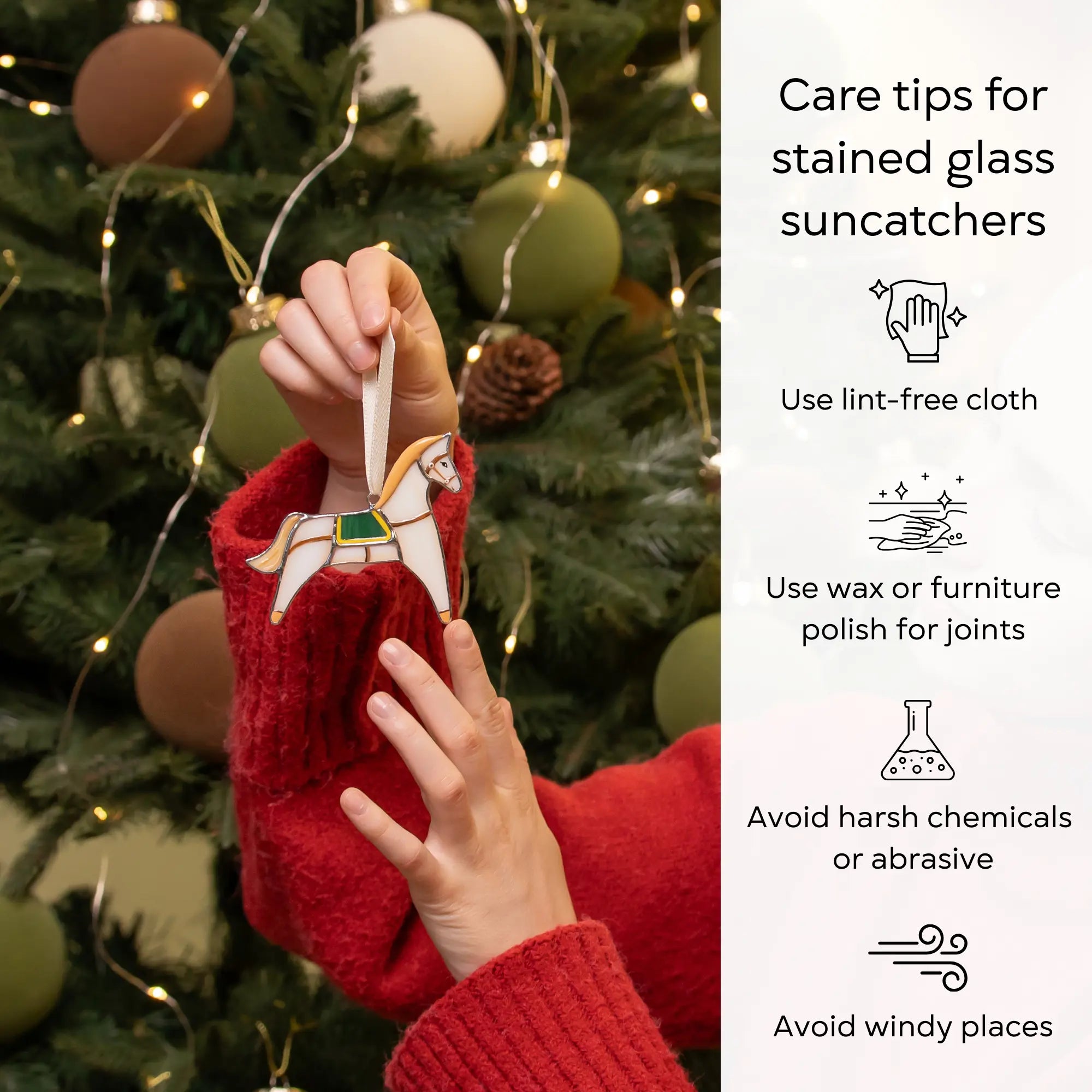 Person holding a stained glass horse suncatcher in front of a decorated Christmas tree with care tips on the right: use lint-free cloth, polish joints with car wax or furniture polish, avoid harsh chemicals, and windy places.