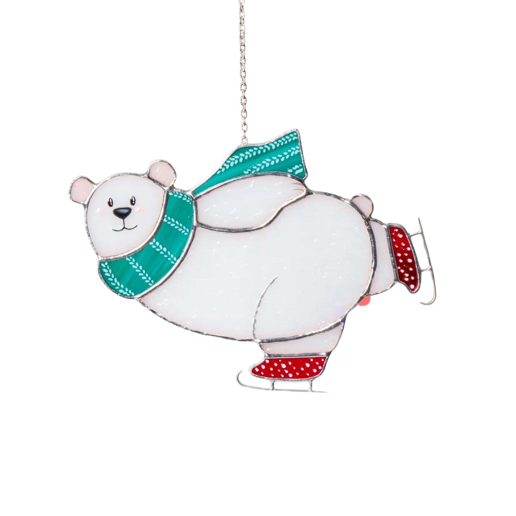 Polar bear with a green scarf and red skates stained glass suncatcher on a white background