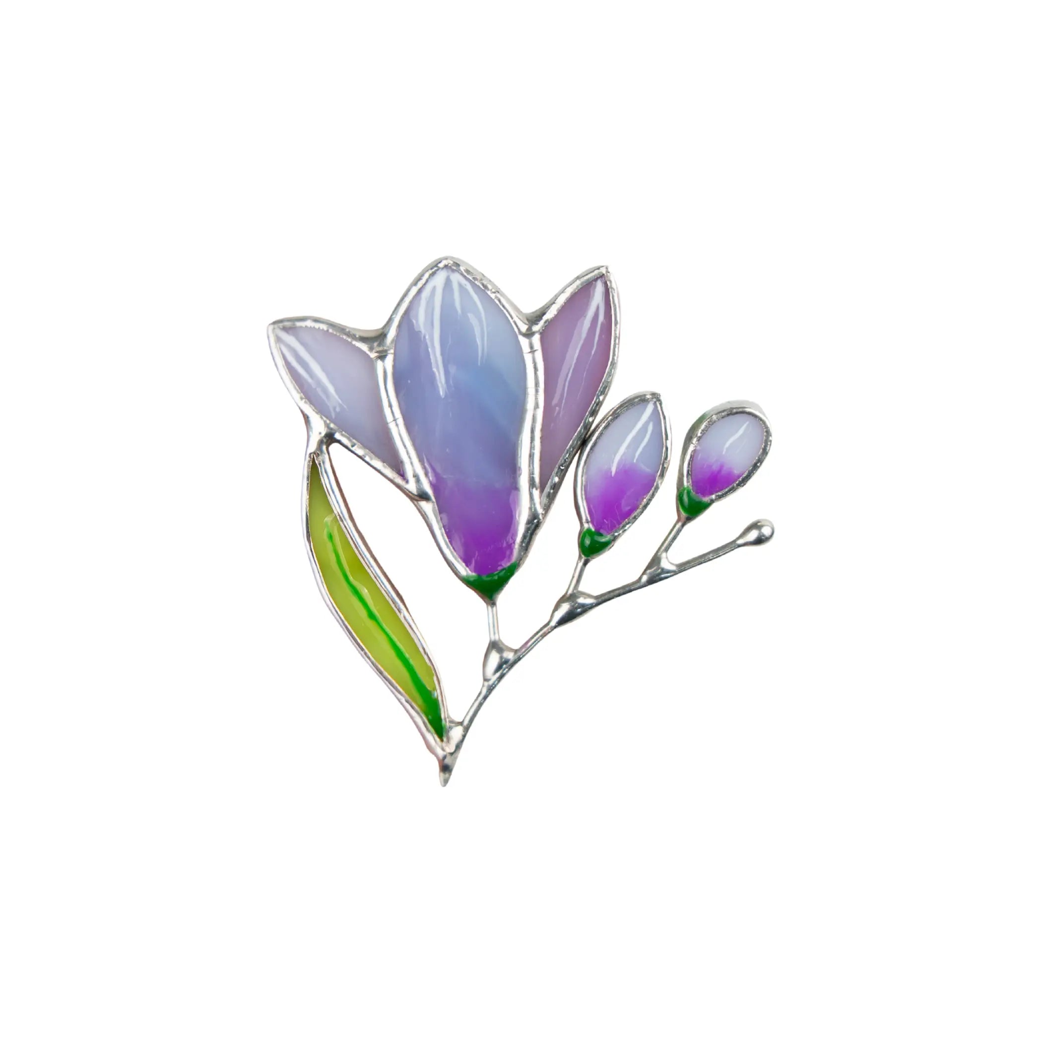 Stained glass brooch shaped like a purple freesia flower with two buds and green leaf