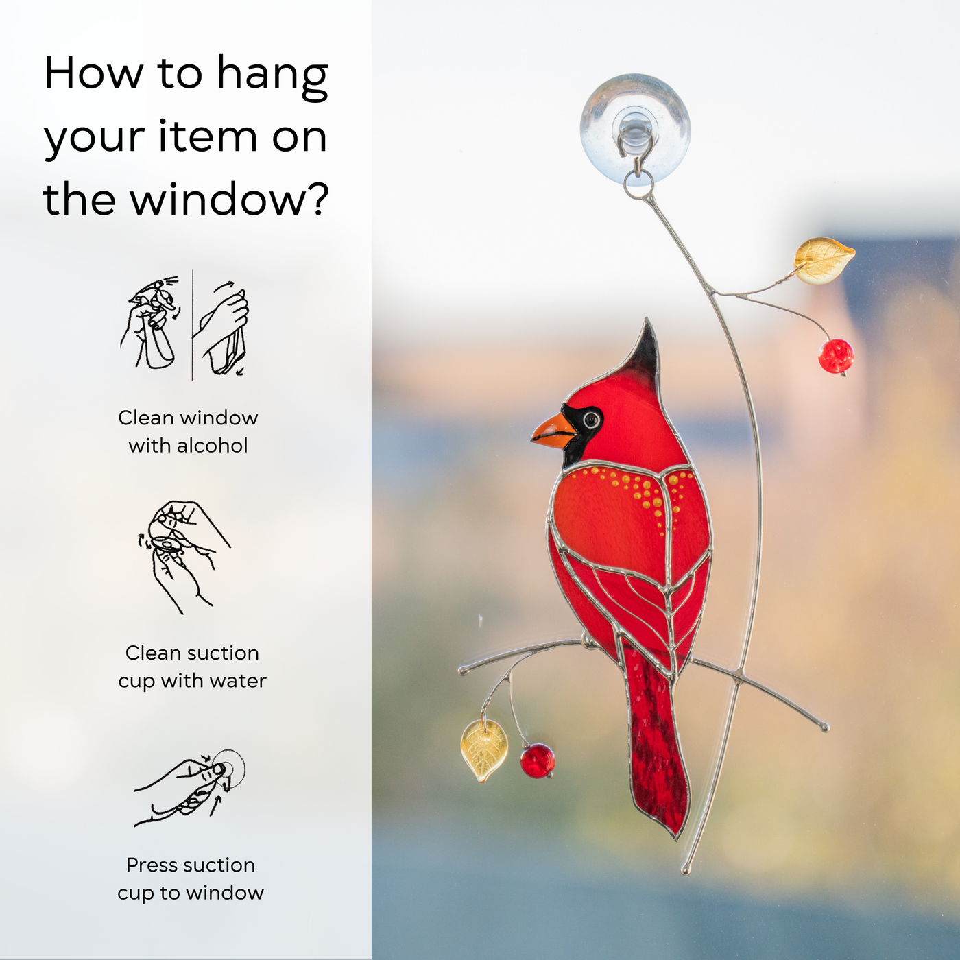 Hanging stained glass cardinal shows how to attach with a suction cup on the window.