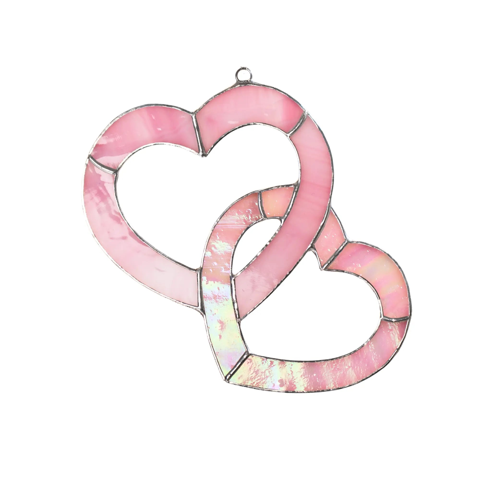 Pink stained glass double heart suncatcher made of soft rose and iridescent glass, intertwined heart shapes with silver solder lines.