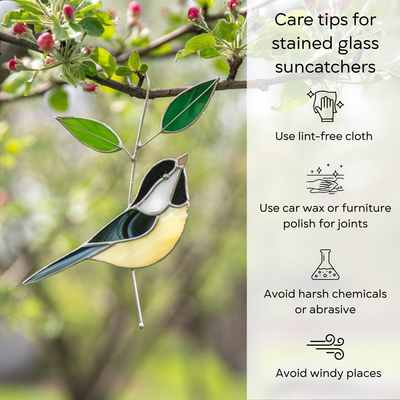 Stained glass chickadee hanging from blooming tree, surrounded by green leaves and pink flower buds, with care tips for suncatchers
