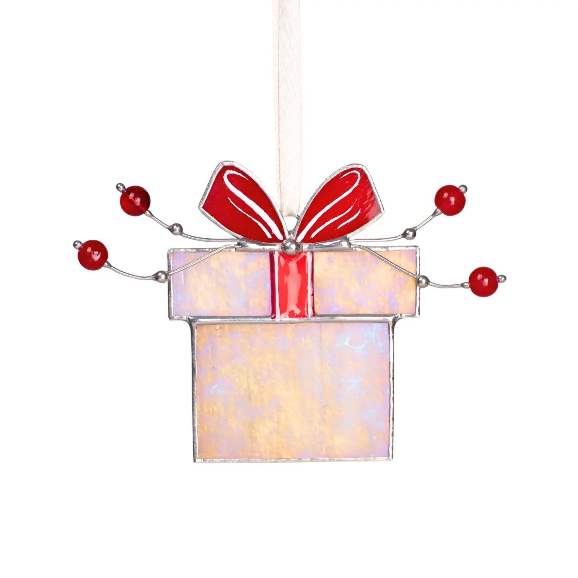 Stained glass Christmas gift box ornament with red bow and festive red beads, perfect for window décor.