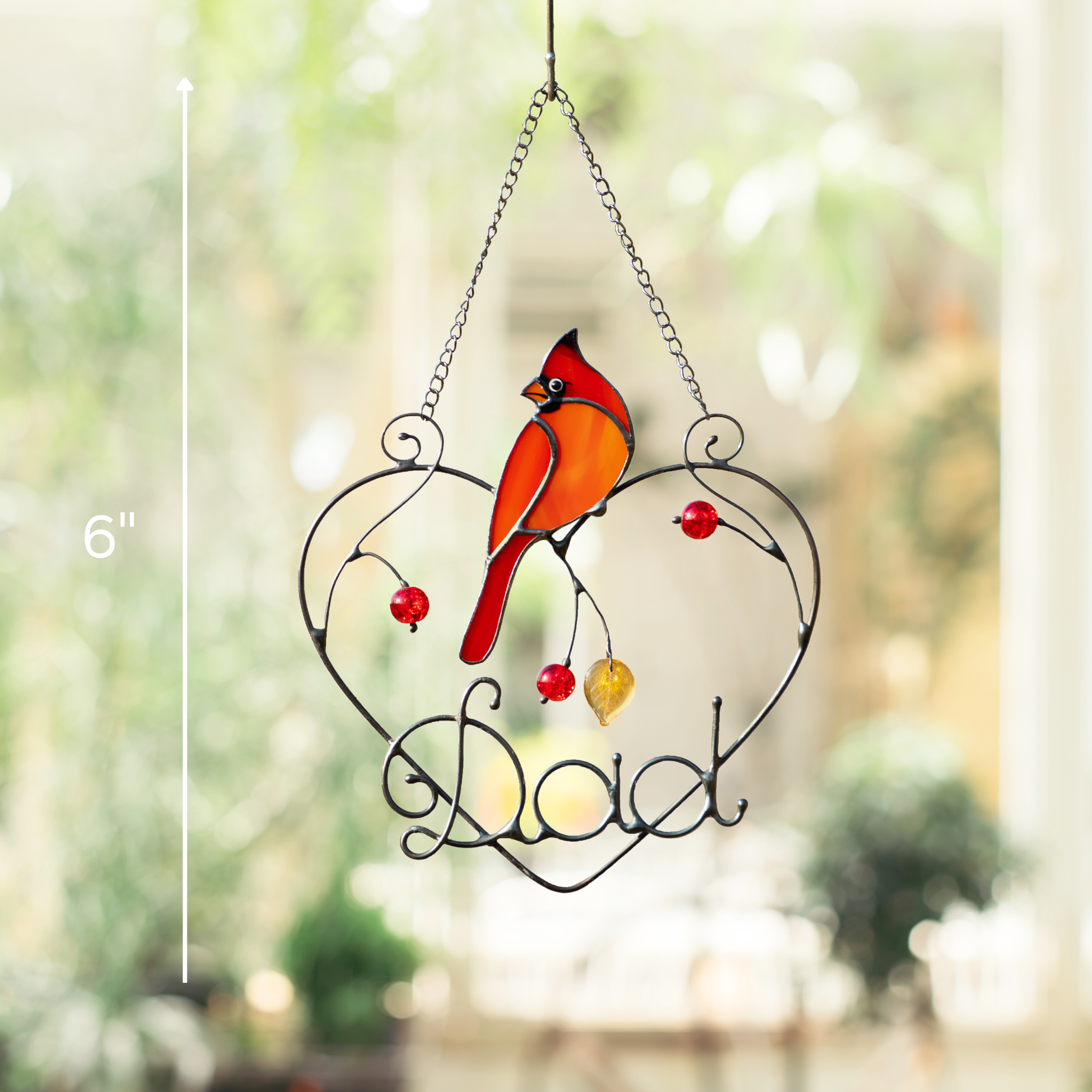 Cardinal suncatcher with “Dad” in heart frame, labeled height 6 inches, hanging in window.