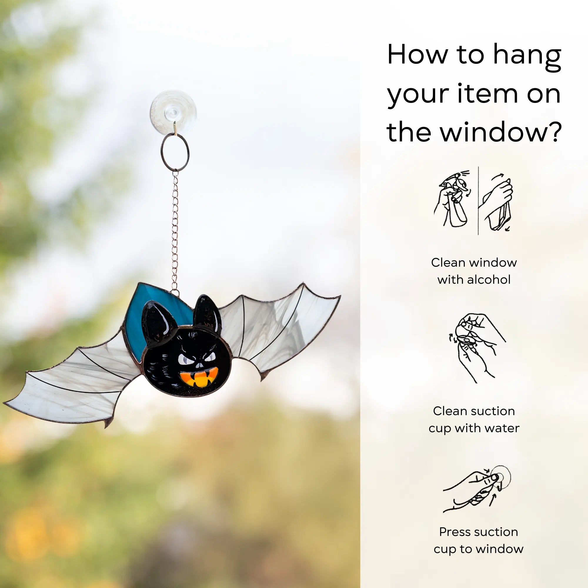 how to hang stained glass bat with fangs  on window: clean window and suction cup, press a cup to the surface