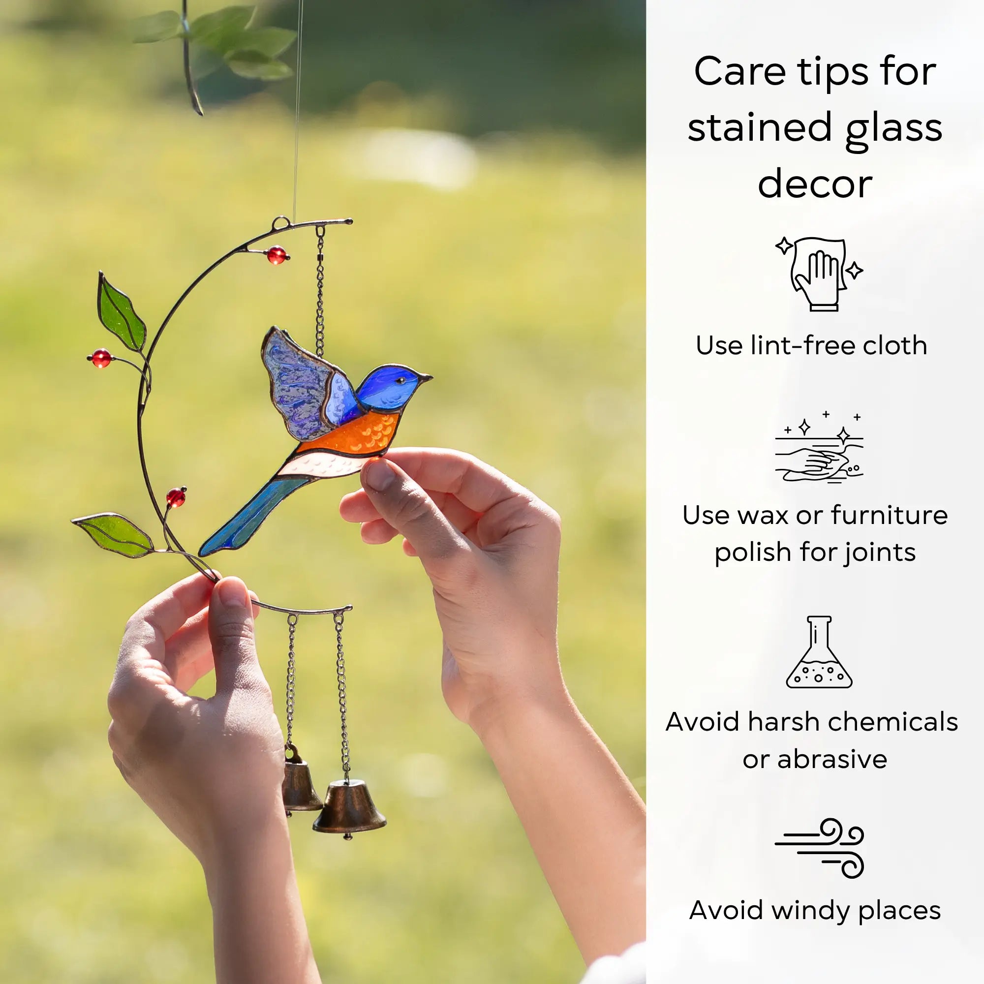 Stained glass bluebird wind chime held by a hand with care tips on the right: use lint-free cloth, polish joints with car wax or furniture polish, avoid harsh chemicals, and windy places.