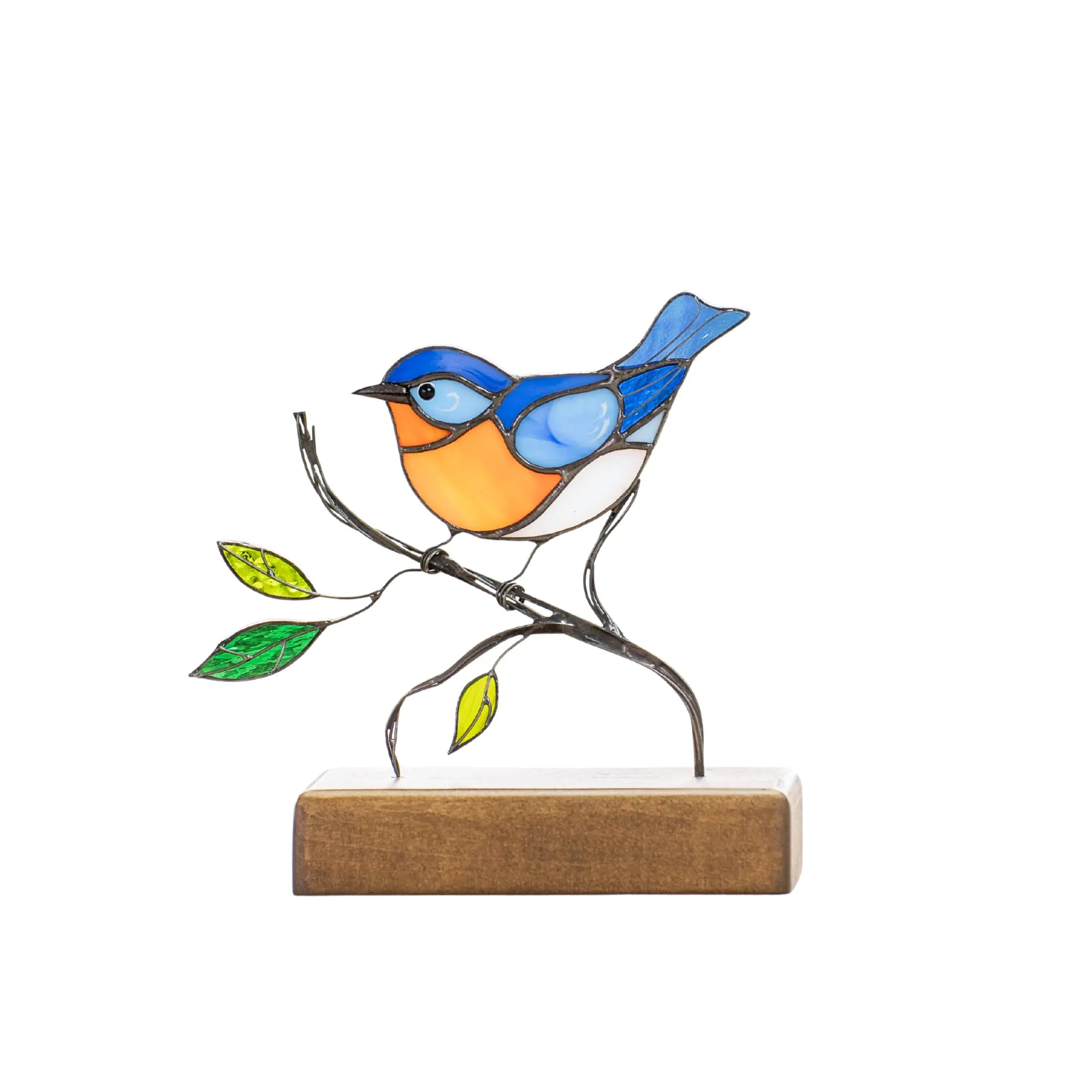 Stained glass bluebird with blue wings and orange belly standing on a natural wooden base