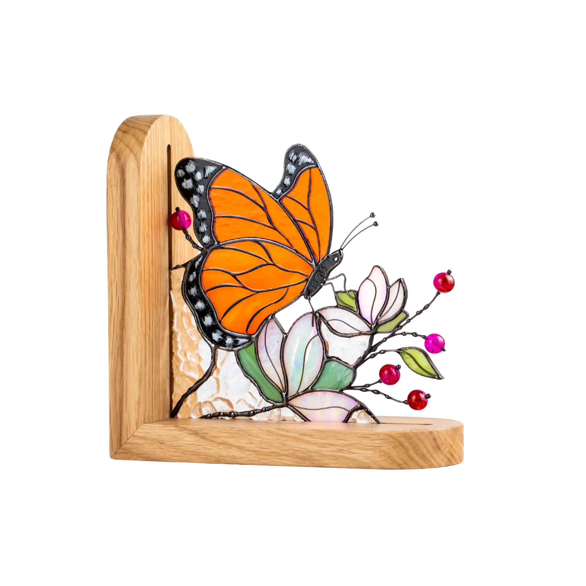 Stained glass butterfly bookend featuring orange wings, floral details, red glass beads, and a wooden base