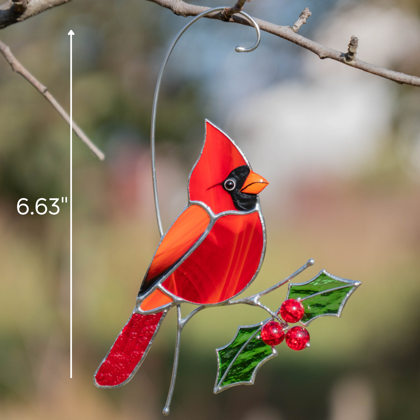 Stained glass cardinal hanging outdoors with size indication of 6.63 inches shown on the image.