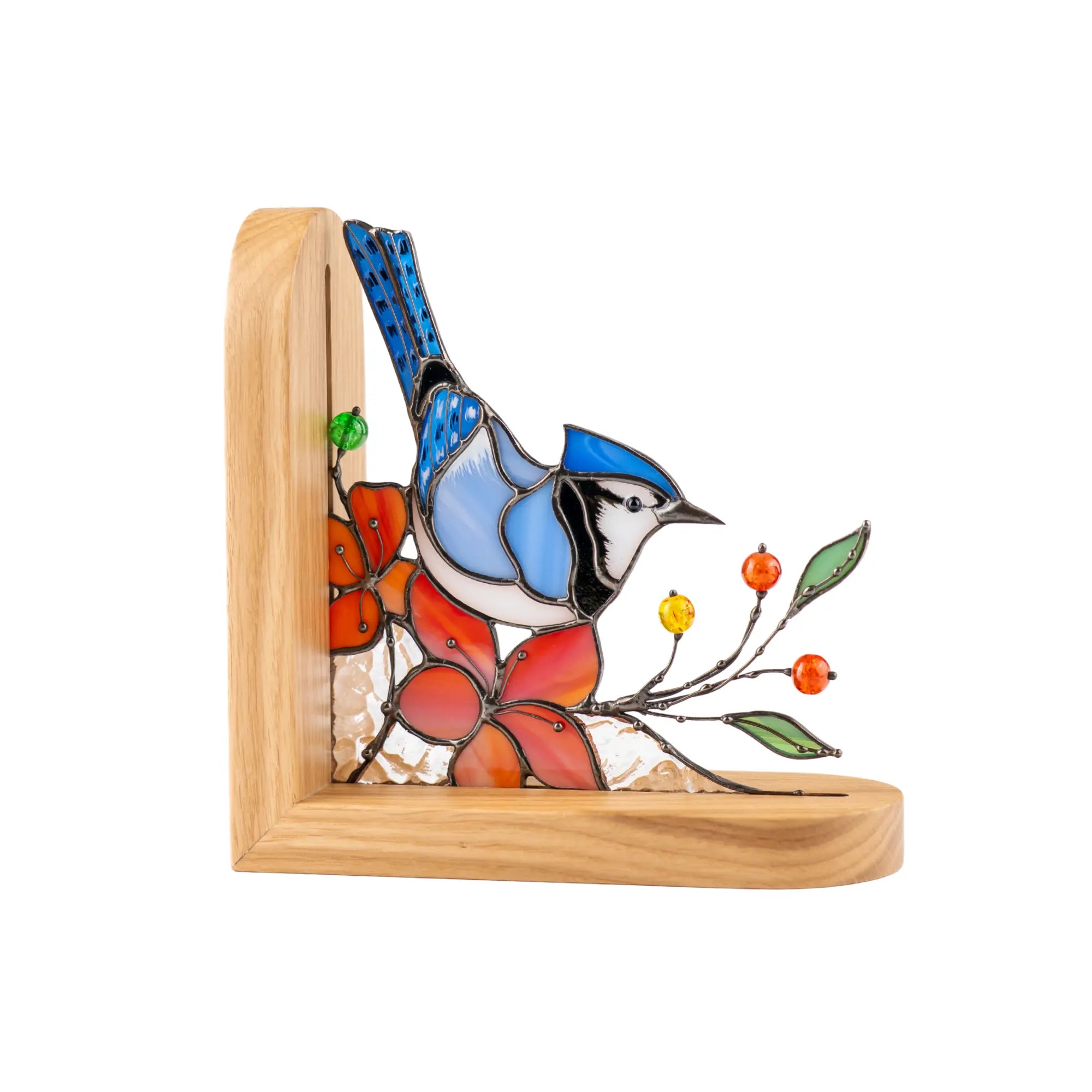 Stained glass bookend with a blue jay and orange flowers design on a wooden base.