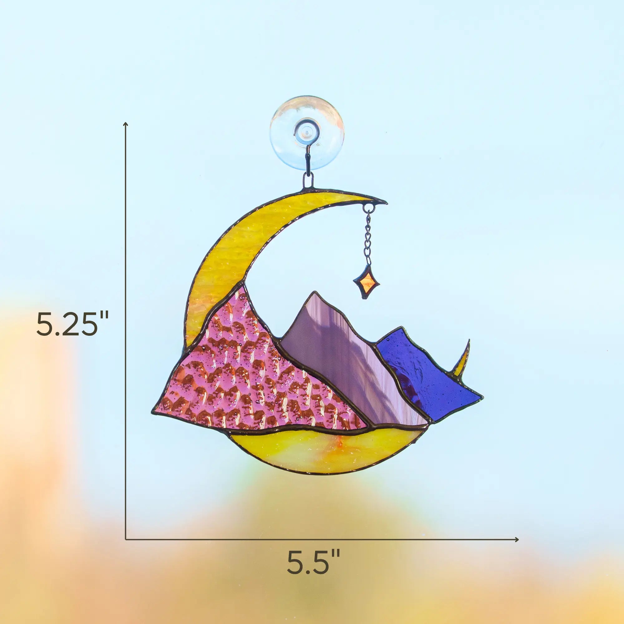 Stained glass crescent moon and mountain celestial suncatcher with dimensions: 5.25 x 5.5 inches