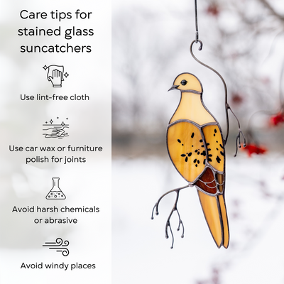 Beige mourning dove hanging in snowy background, next to tips for cleaning stained glass safely: use lint-free cloth, use wax polish for joints, no harsh cleaners, avoid wind.