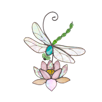 Stained glass dragonfly with shimmering wings and green beads hovering above a pink lotus flower.