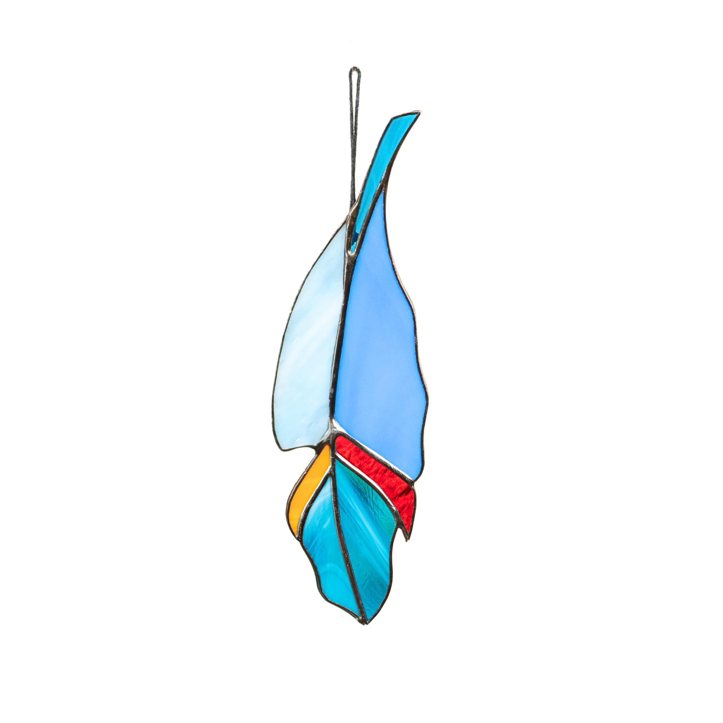 Colorful feather suncatcher made of stained glass in light blue, royal blue, red, orange, and turquoise shades, hanging on a black cord.
