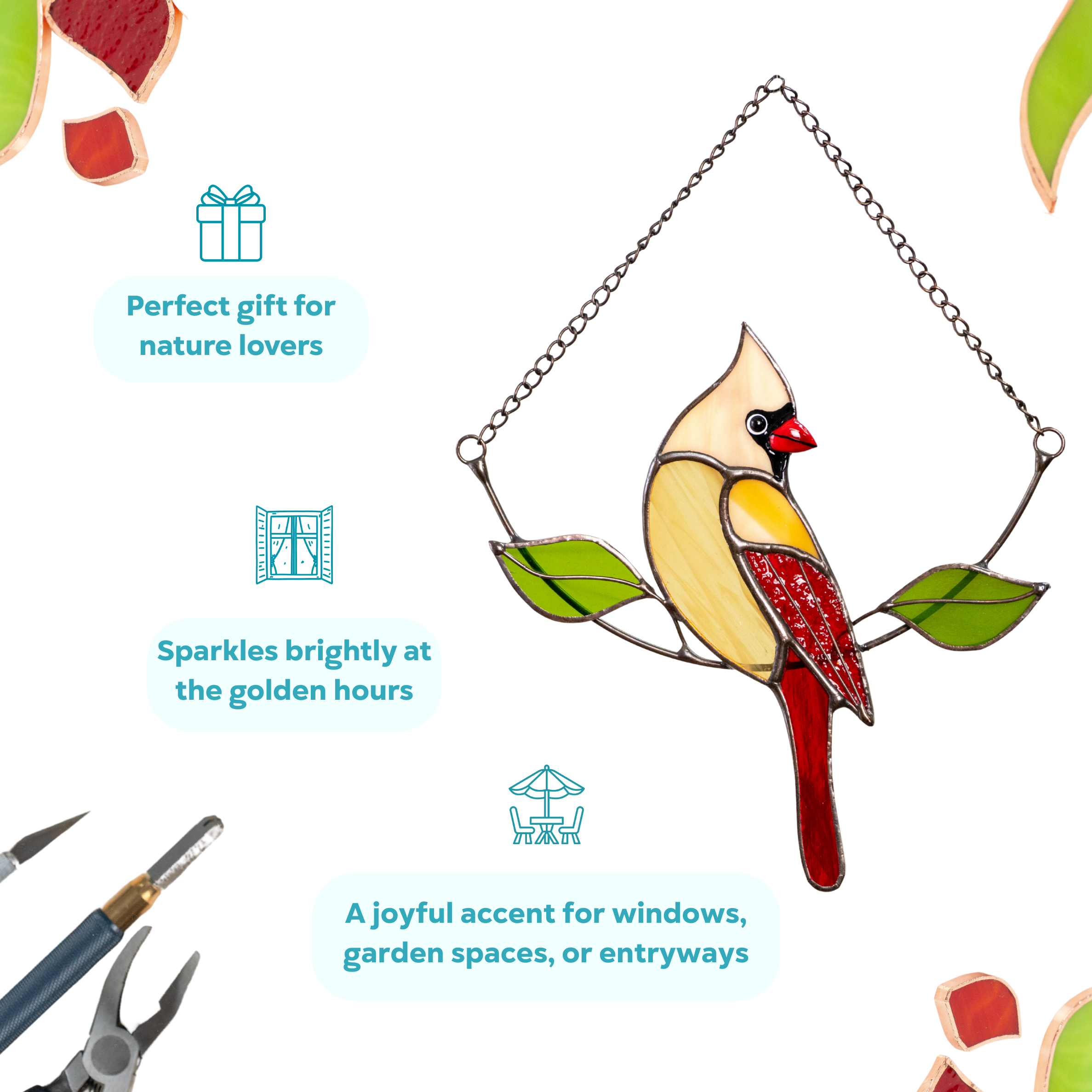 Beige and red stained glass female cardinal hanging on a metal chain with two green leaves, perfect gift for any occasion
