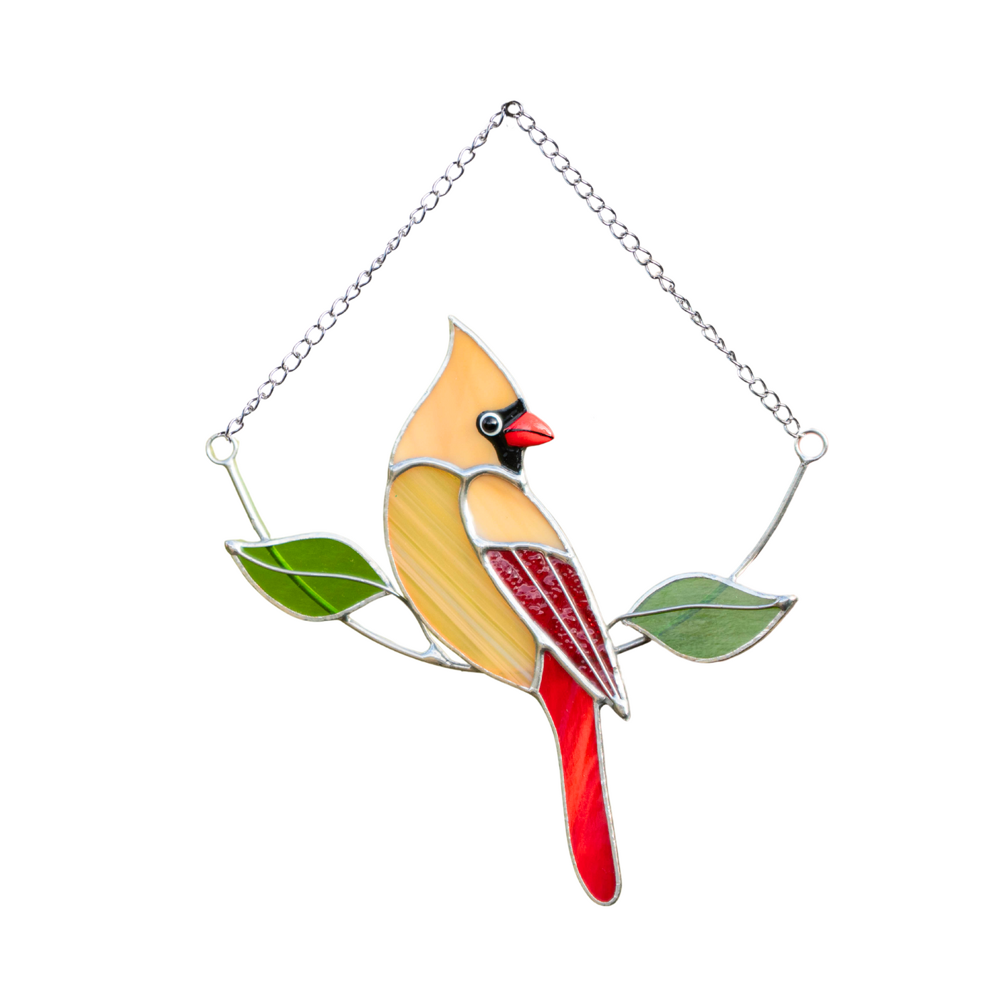 Female cardinal in beige stained glass with green glass leaves.