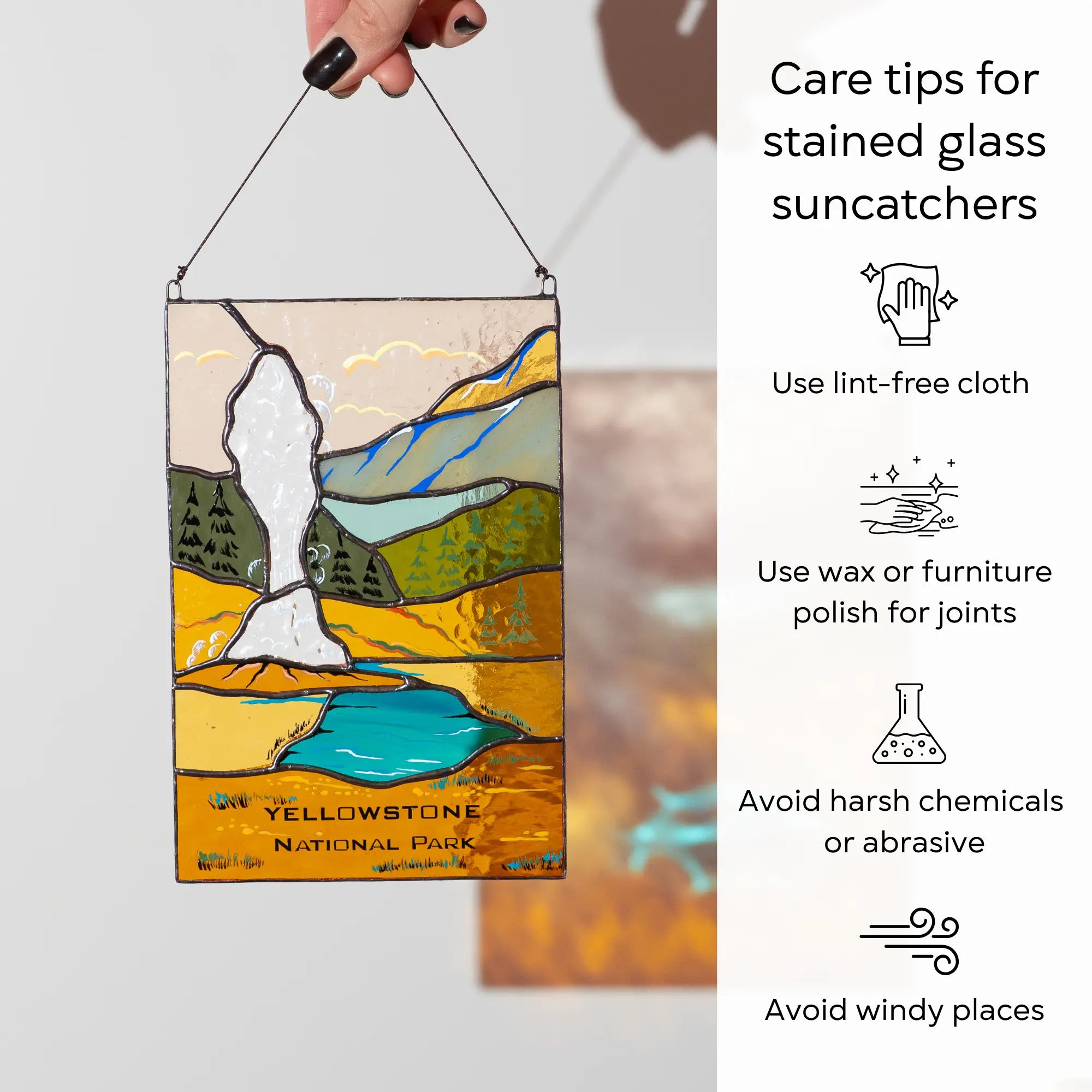 A hand holding the geyser stained glass panel next to care tips for cleaning and maintenance.: use lint-free cloth, polish joints with car wax or furniture polish, avoid harsh chemicals, and windy places.