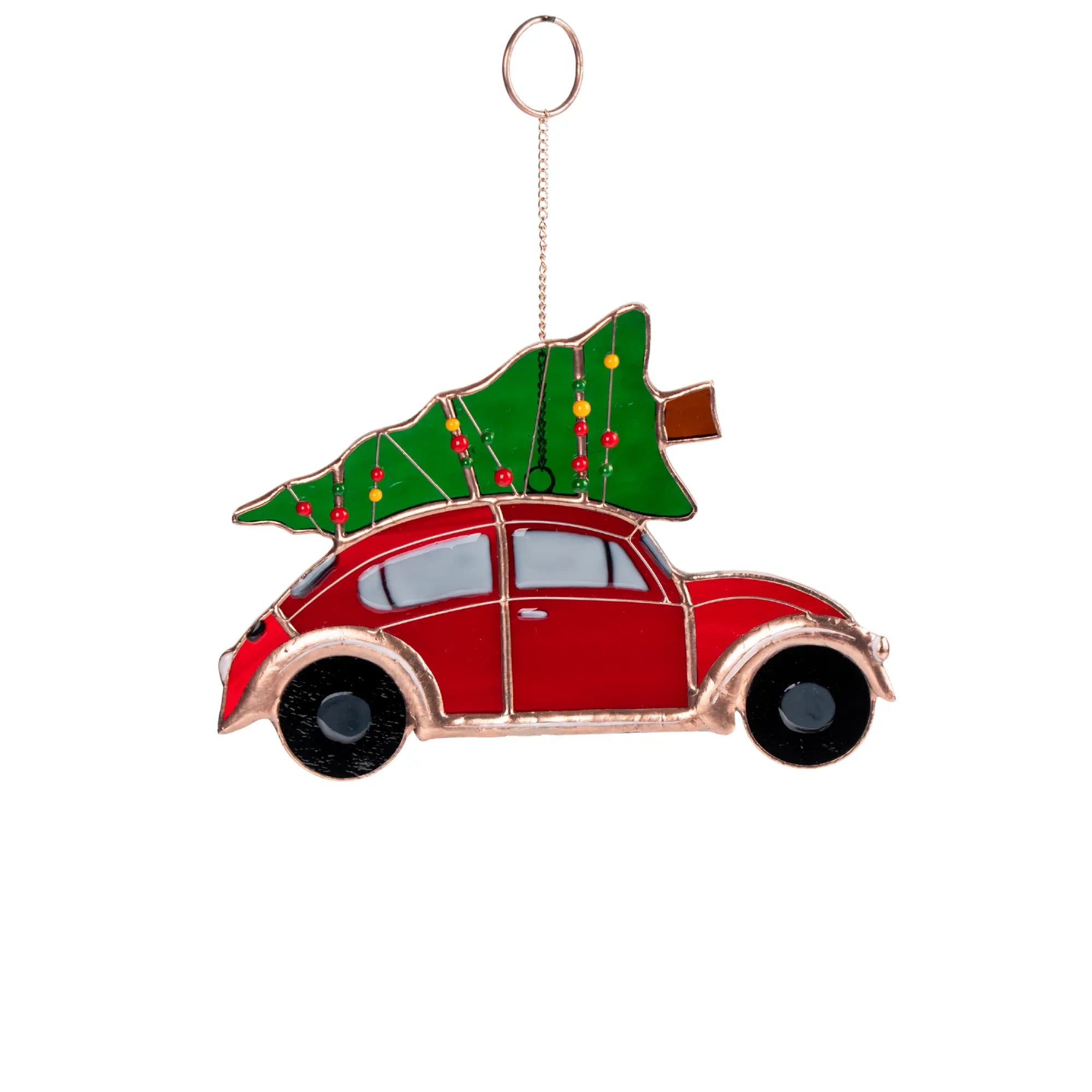 Stained glass Christmas ornament of a red car with a Christmas tree on top against a white background