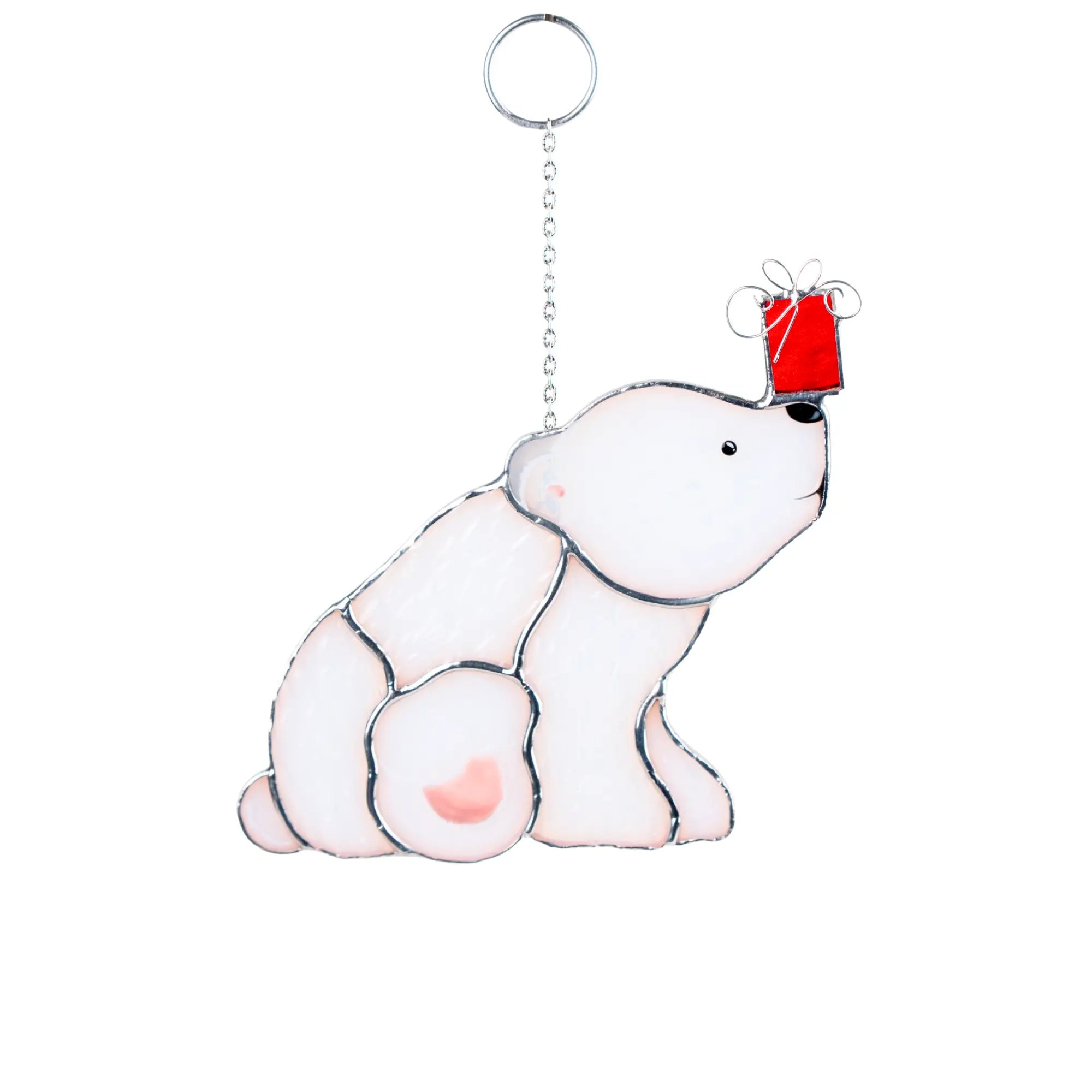 Stained glass suncatcher with a polar bear holding a red gift box on a white background