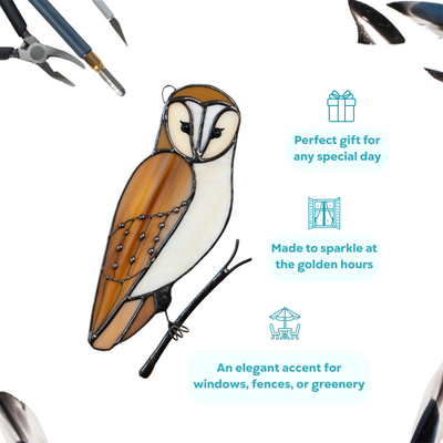 Barred owl stained glass piece with creamy white and amber glass, perched on a metal branch