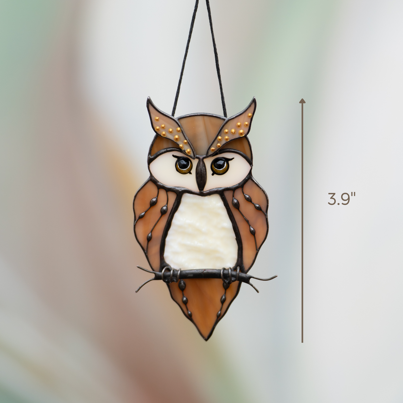 Stained glass owl with bright eyes and warm feathers, hanging from black cord, sized 3.9 inches