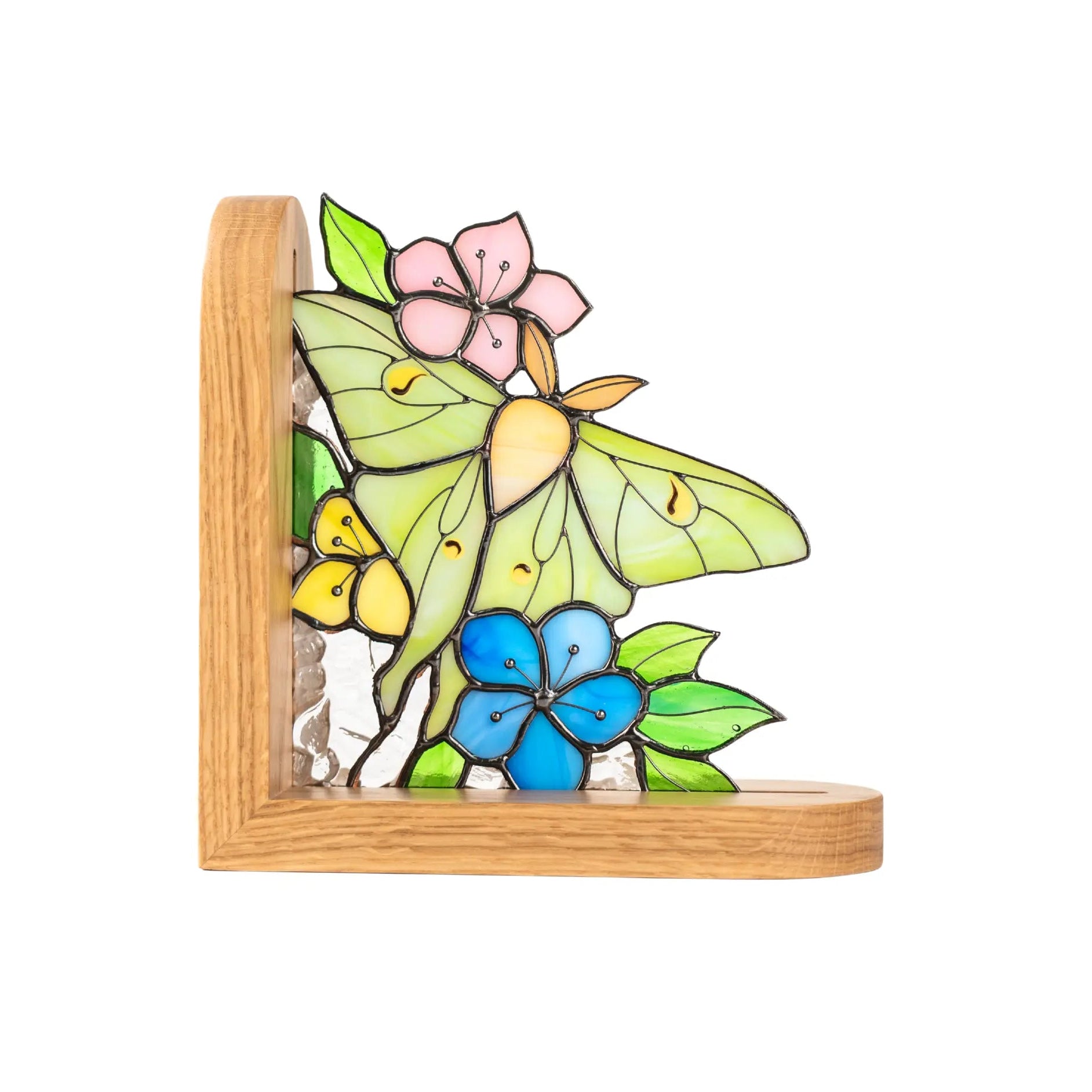 Stained glass bookend with luna moth butterfly and flower design on a wooden base