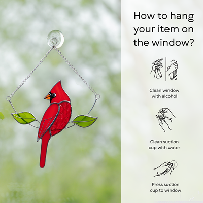 Window-mounted cardinal suncatcher with chain and suction cup, shown with hanging instructions