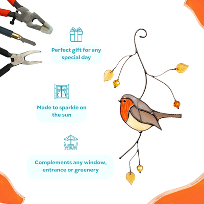 Robin suncatcher with orange-red breast and yellow leaf beads, surrounded by tools