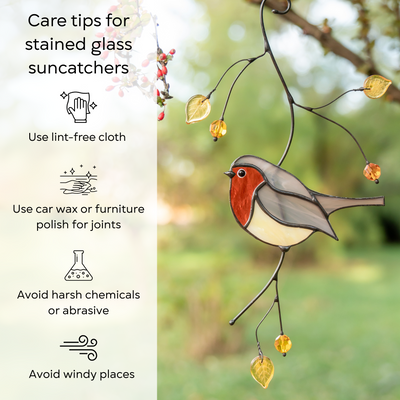 Robin bird suncatcher hanging outdoors with yellow leaves, beside illustrated care instructions: use lint-free cloth, use wax polish for joints, no harsh cleaners, avoid wind.